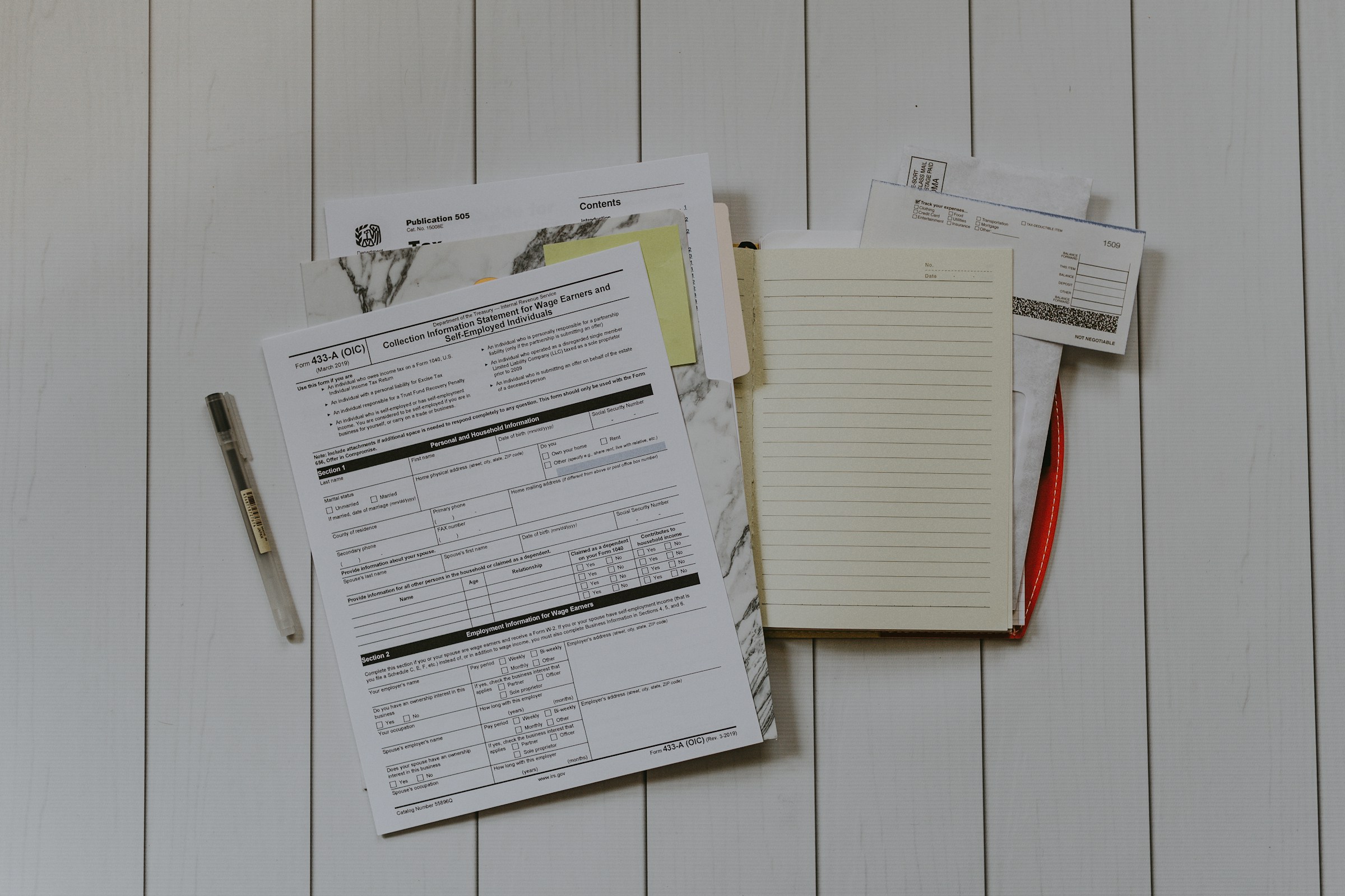 A stack of paperwork | Source: Unsplash