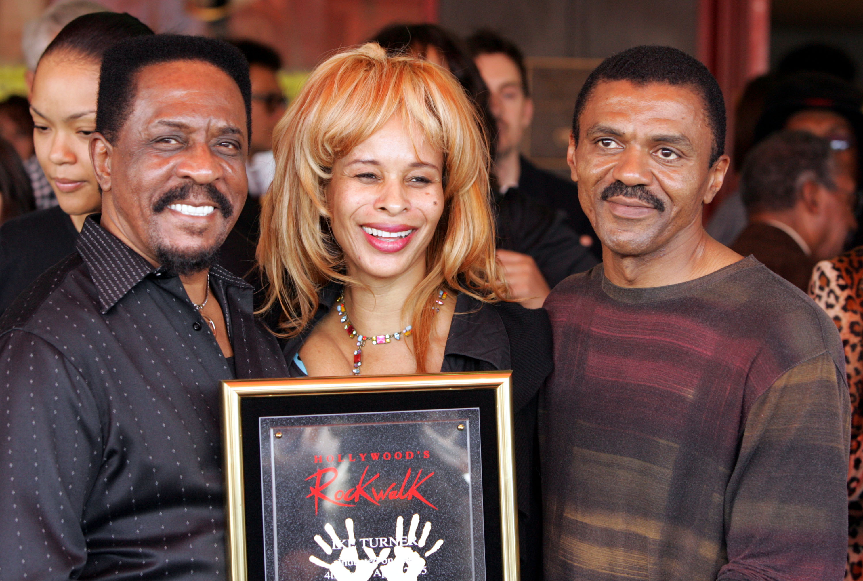 Ike Turner (L) stands with guest Audrey Madison and Ike Turner Jr. after he was inducted into the Hollywood Rockwalk along with Muddy Waters, Robert Cray, Solomon Burke and Etta James on April 4, 2005 in Hollywood, California. | Source: Getty Images