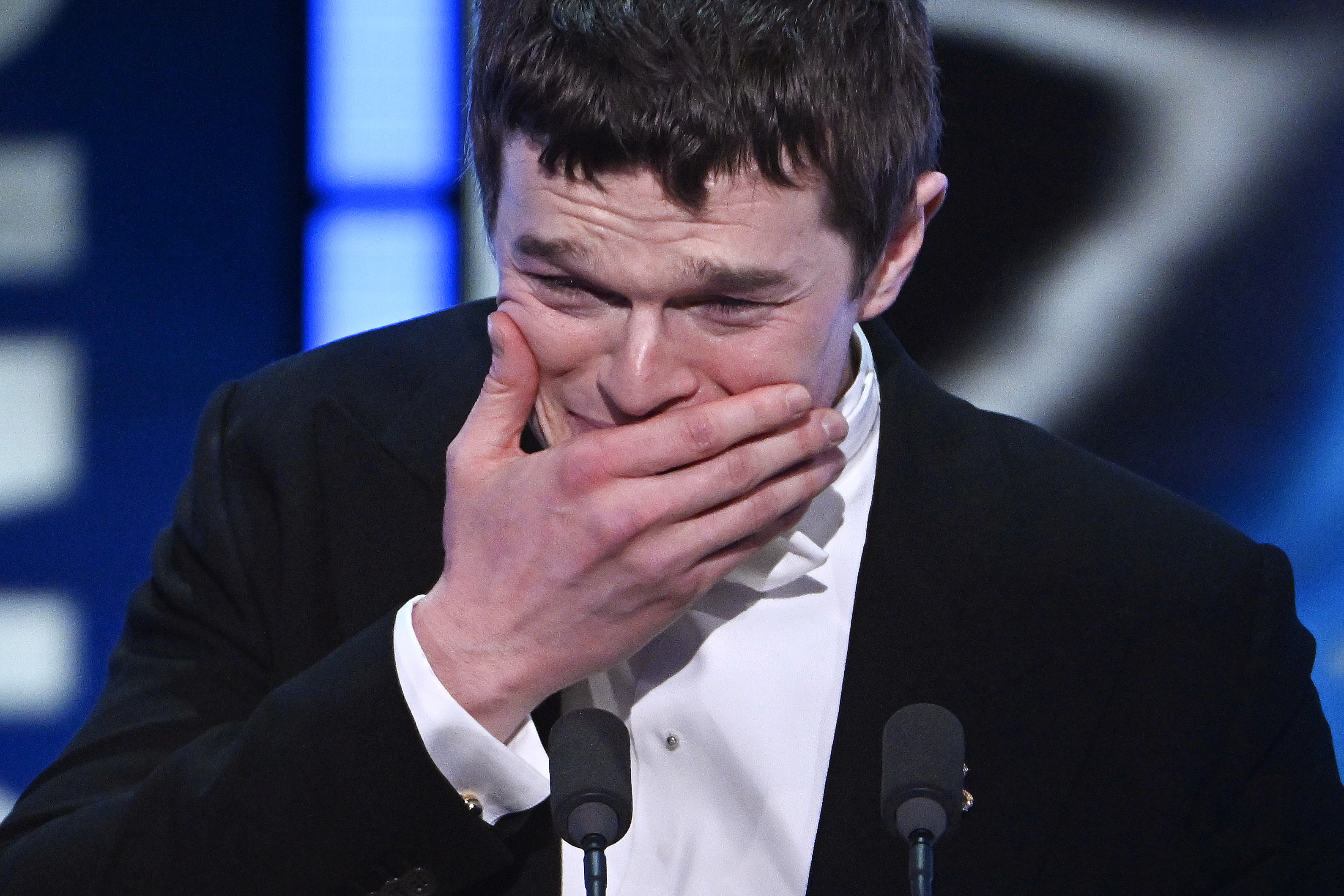 Robert Aramayo accepts the Leading Actor Award for "I Swear" during the EE BAFTA Awards on February 22, 2026, in London, England. | Source: Getty Images