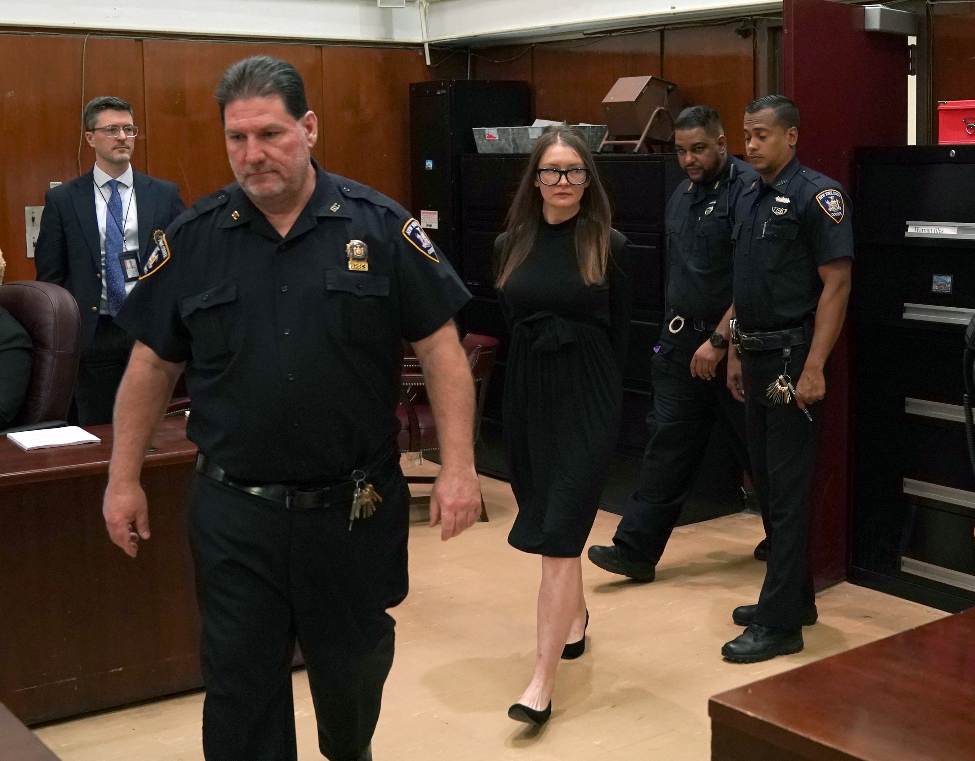 Anna Sorokin is photographed as she arrives in court for her sentencing at ...