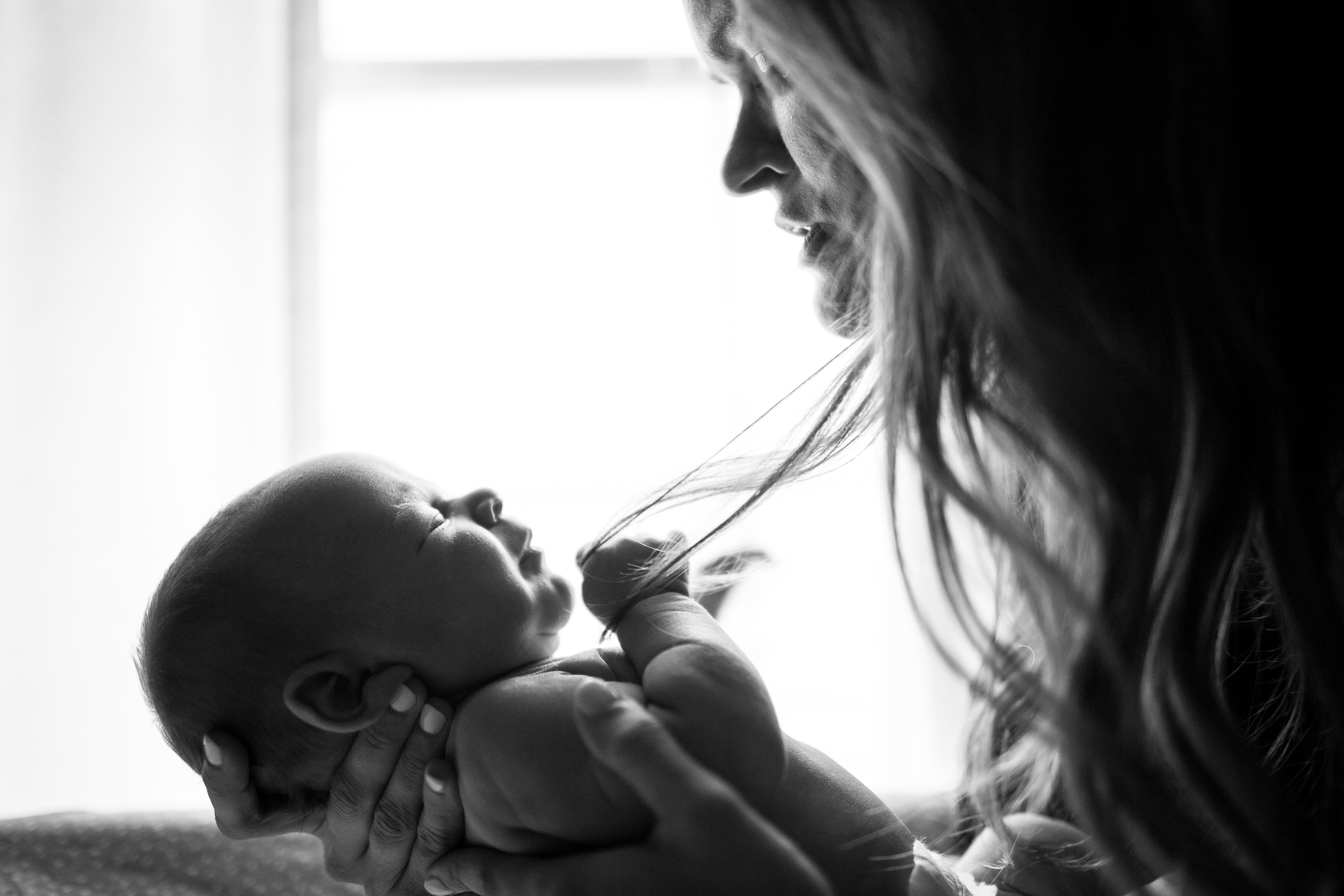 A mother holding her child. | Source: Unsplash