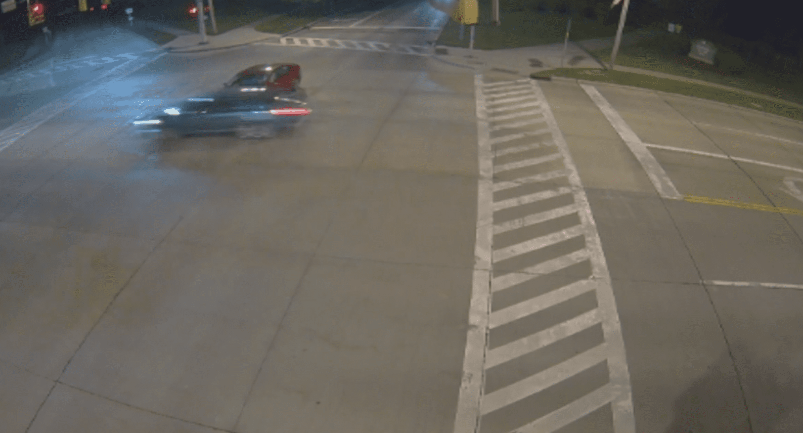 A traffic camera spots a woman speeding through a red light and crashing into a car | Photo: Youtube/FollowtheDominoes