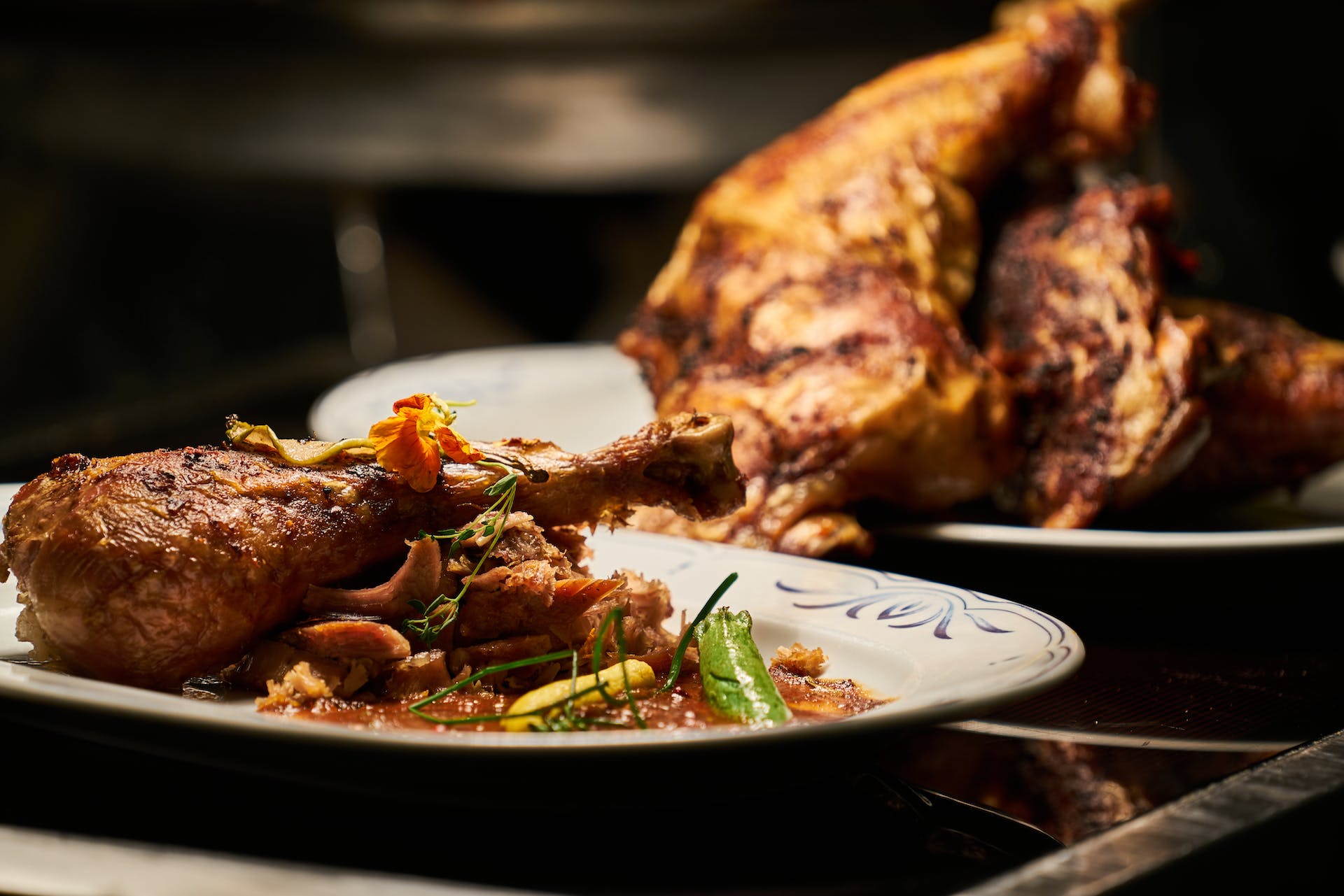 Roast chicken on plates | Source: Pexels