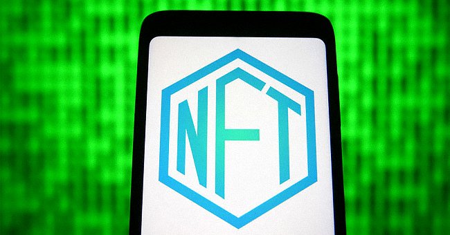 In this photo illustration a NFT sign is seen on a smartphone screen. | Source: Getty Images