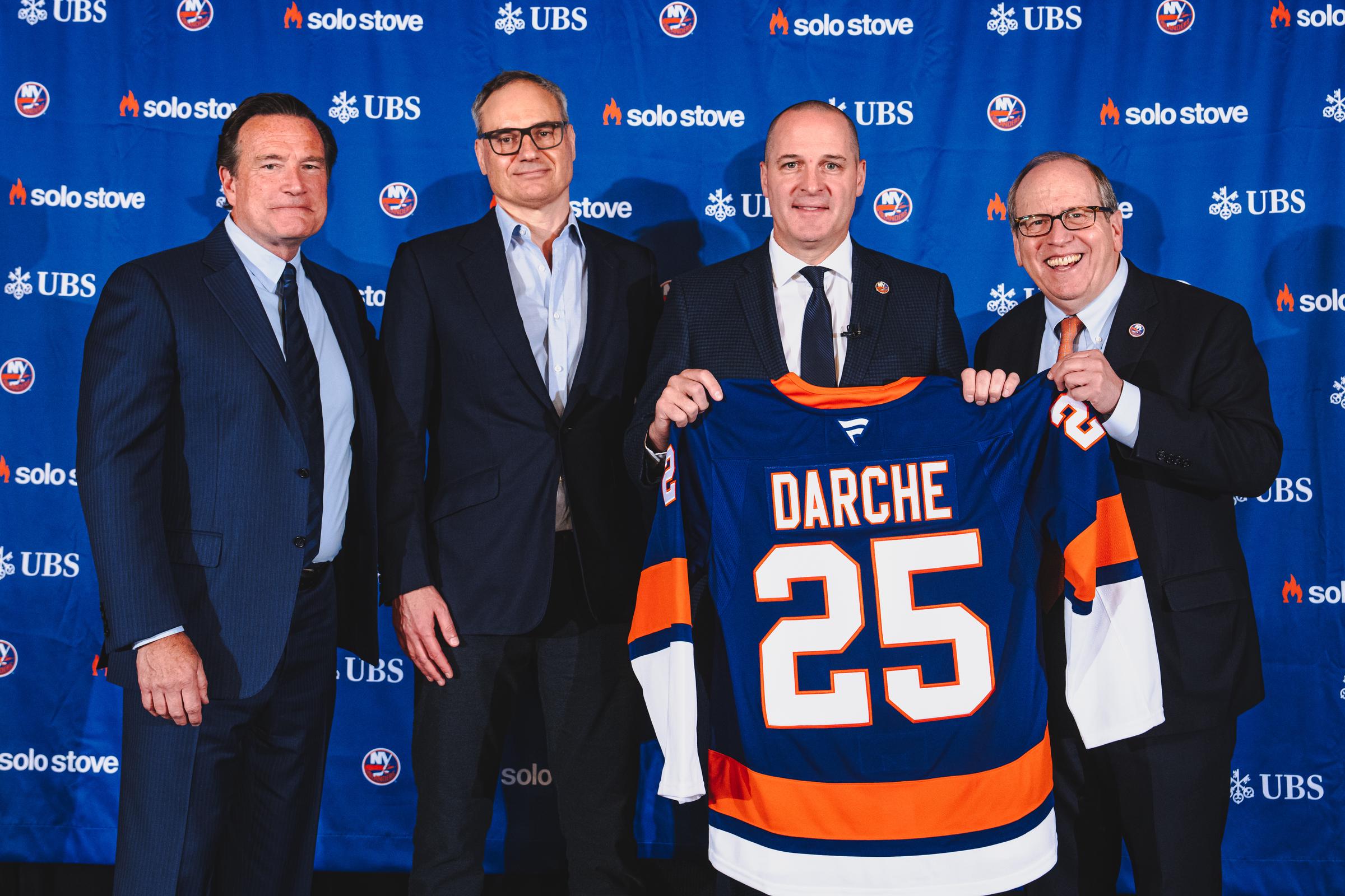 Mathieu Darche poses for a photo with Islanders owners John Collins, Jon Ledecky, and Oliver Haarmann after being named the 7th General Manager in New York Islanders history at UBS Arena, on May 29, 2025, in Elmont, New York | Source: Getty Images