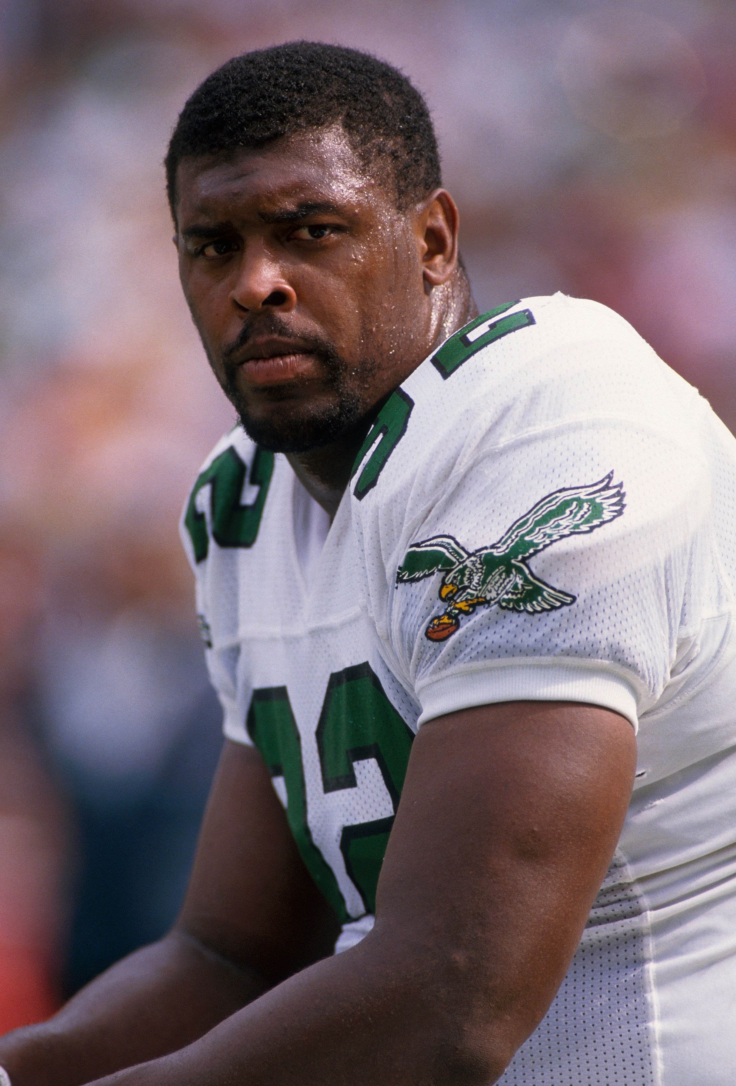 Reggie White #92 sits on the sideline during a game in 1991 at Veterans Stadium in Philadelphia, Pennsylvania. | Source: Getty Images