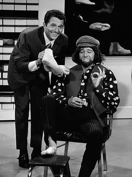 George Carlin (right, in costume) and singer Buddy Greco (left) in a skit from the summer replacement television program "Away We Go." | Source: Wikimedia Commons