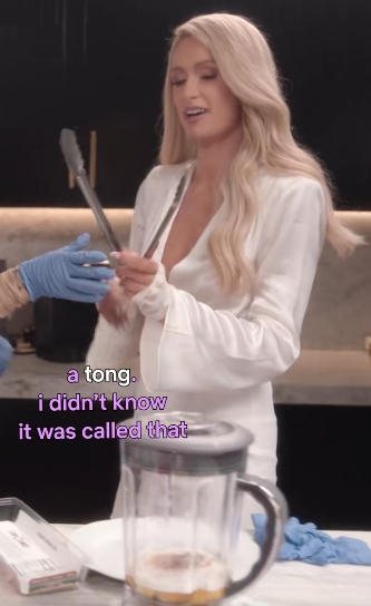 Paris Hilton holds a pair of tongs while admitting she did not know the kitchen utensil's proper name in a post shared on August 4, 2021. | Source: TikTok/Netflix