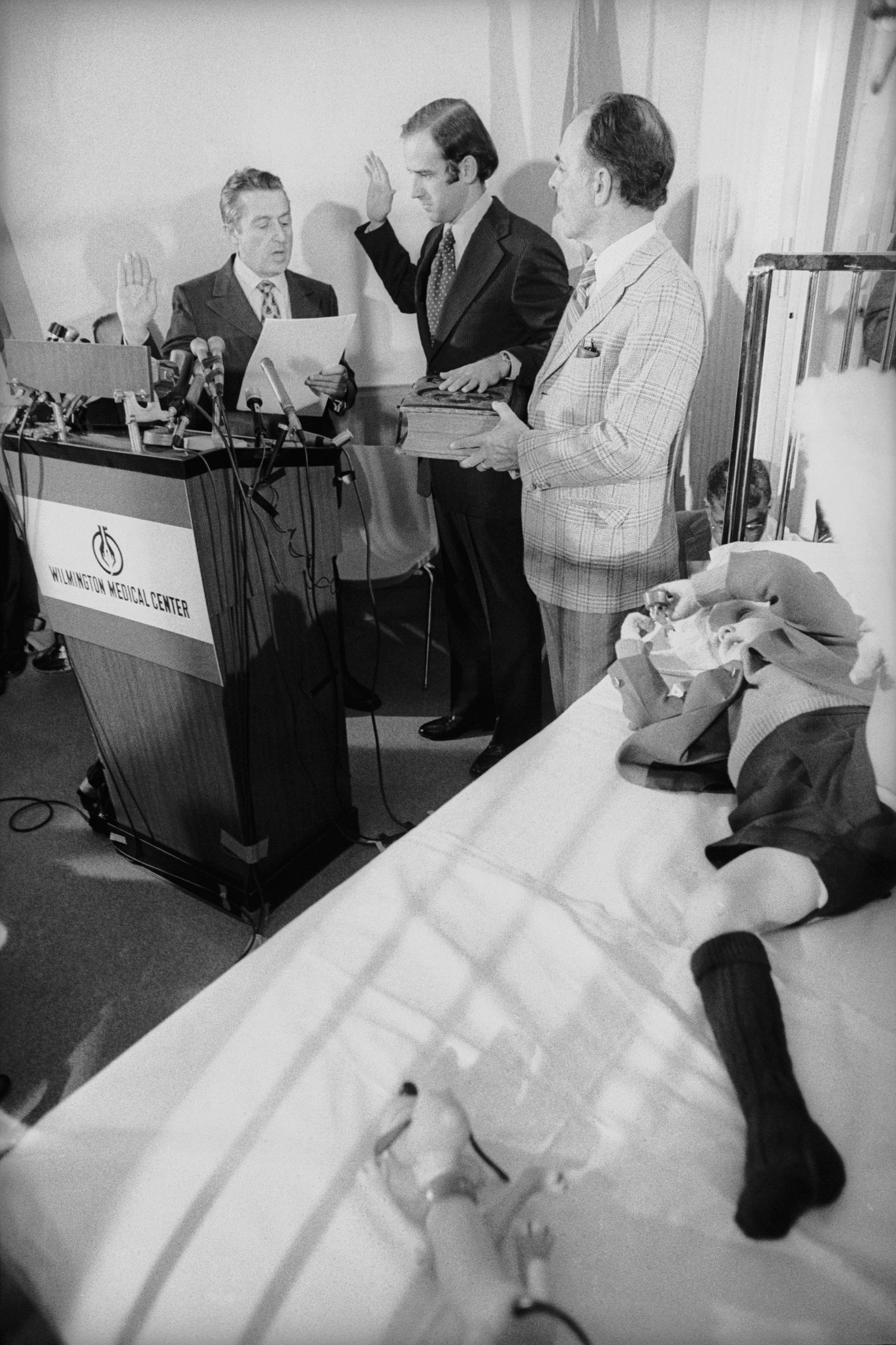 Joe Biden is sworn in as a U.S. Senator at Wilmington Medical Center on January 5, 1973, as his son Beau recovers from injuries sustained in the car crash that killed his wife Neilia and daughter Naomi. | Source: Getty Images