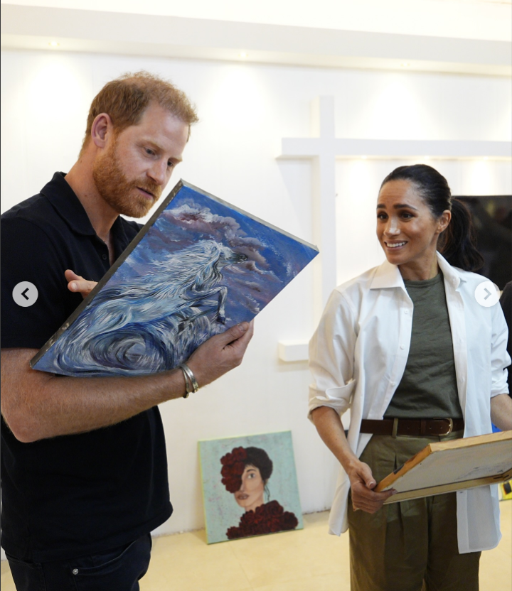 Prince Harry and Meghan Markle viewing art pieces during their 2-day visit to Jordan | Source: Instagram/HelloMag