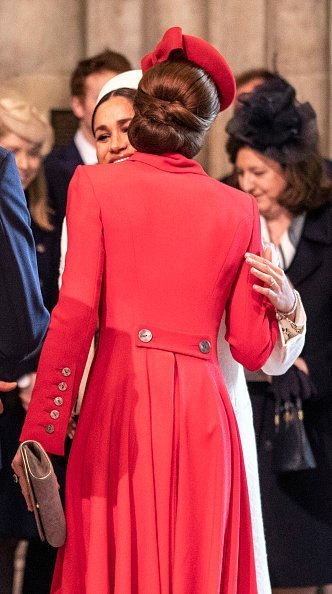 Meghan Markle and Kate Middleton embrace at the 2019 Commonwealth Day service at Westminster Abbey on March 11, 2019 in London, England. | Photo: Getty Images