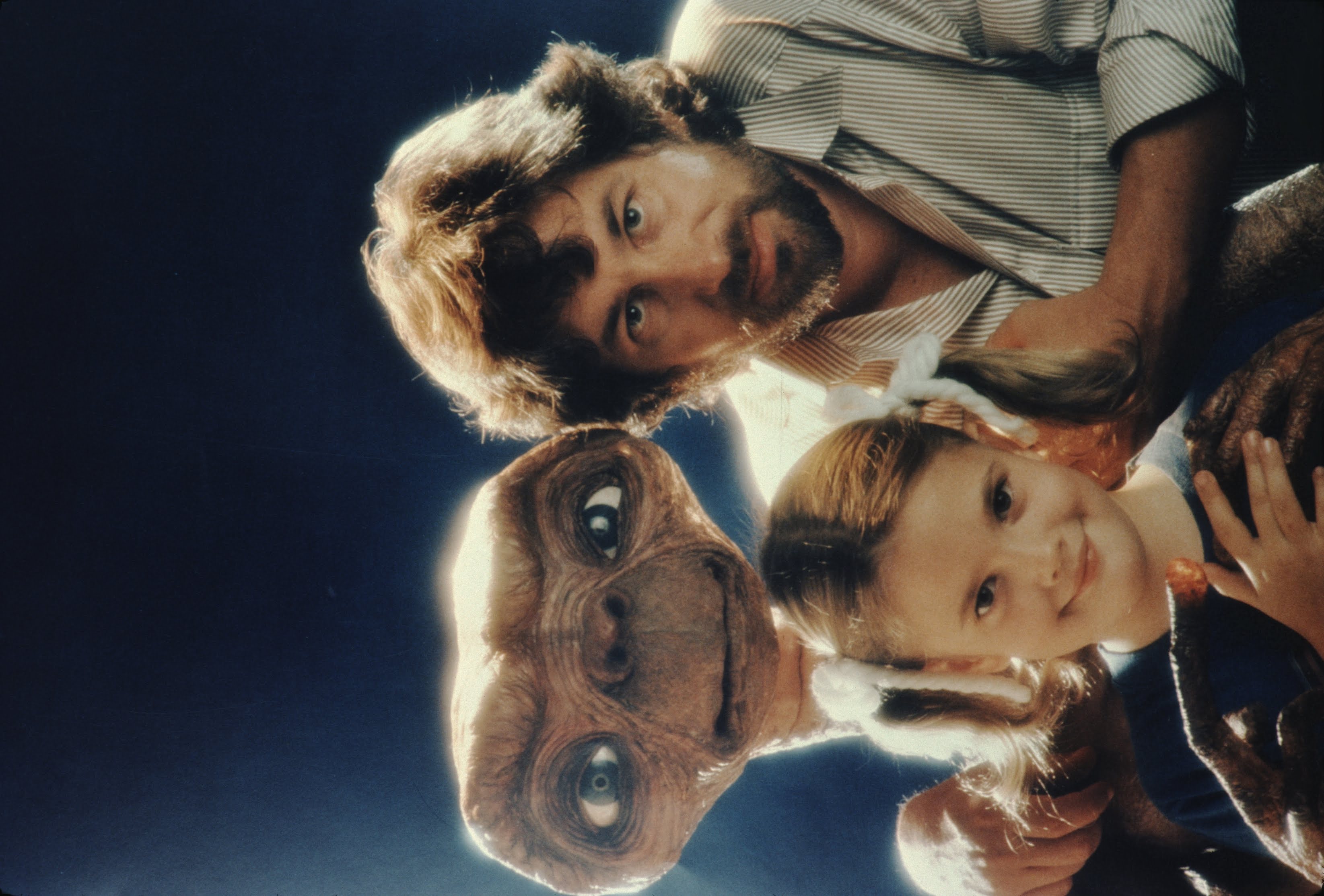 Steven Spielberg and the movie star pose with E.T. at Carlo Rimbaldi studio in Los Angeles, California in April, 1982. | Source: Getty Images
