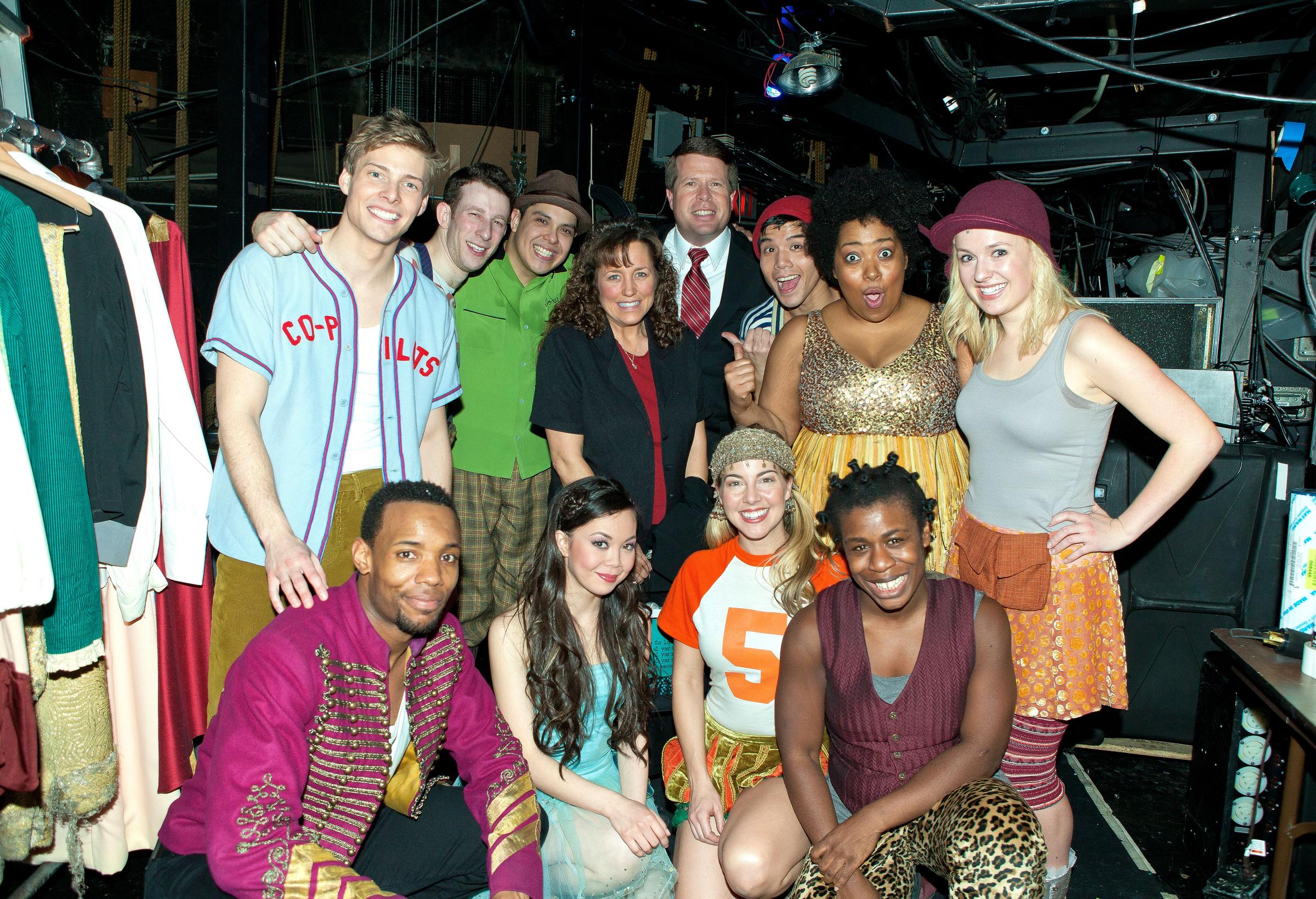 Jim Bob Duggar and Michelle Duggar from "19 Kids and Counting" pose with the cast backstage at the hit musical "Godspell" in New York City, on February 16, 2012 | Source: Getty Images