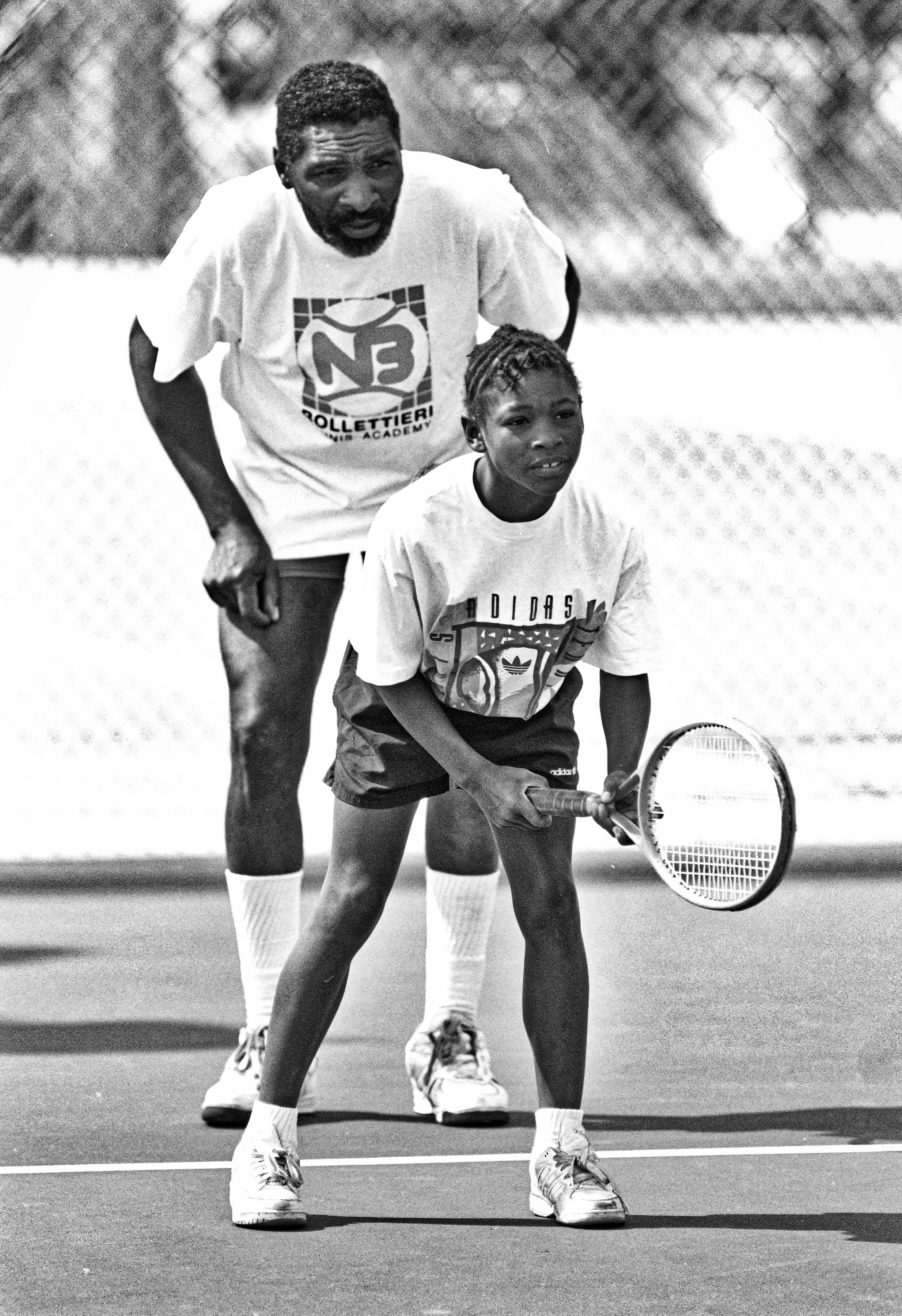 Richard WIlliams is pictured with his daughter, Serena, during a training session at the Compton tennis courts on April 20, 1991, in South Central Los Angeles, California | Source: Getty Images