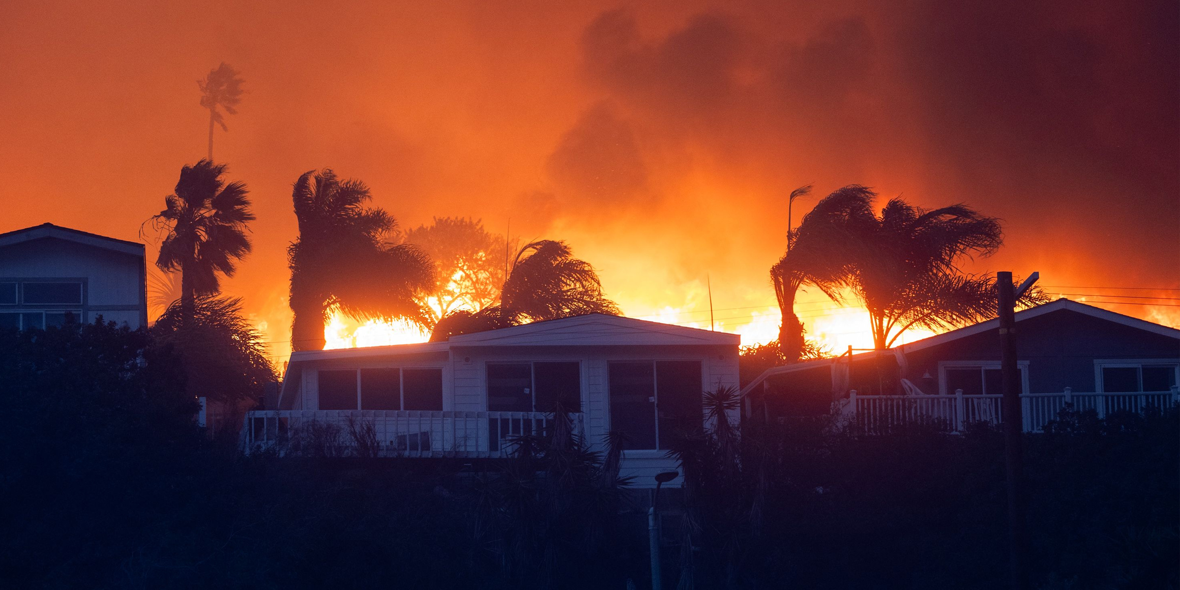 A wildfire set behind a home in California. | Source: Getty Images