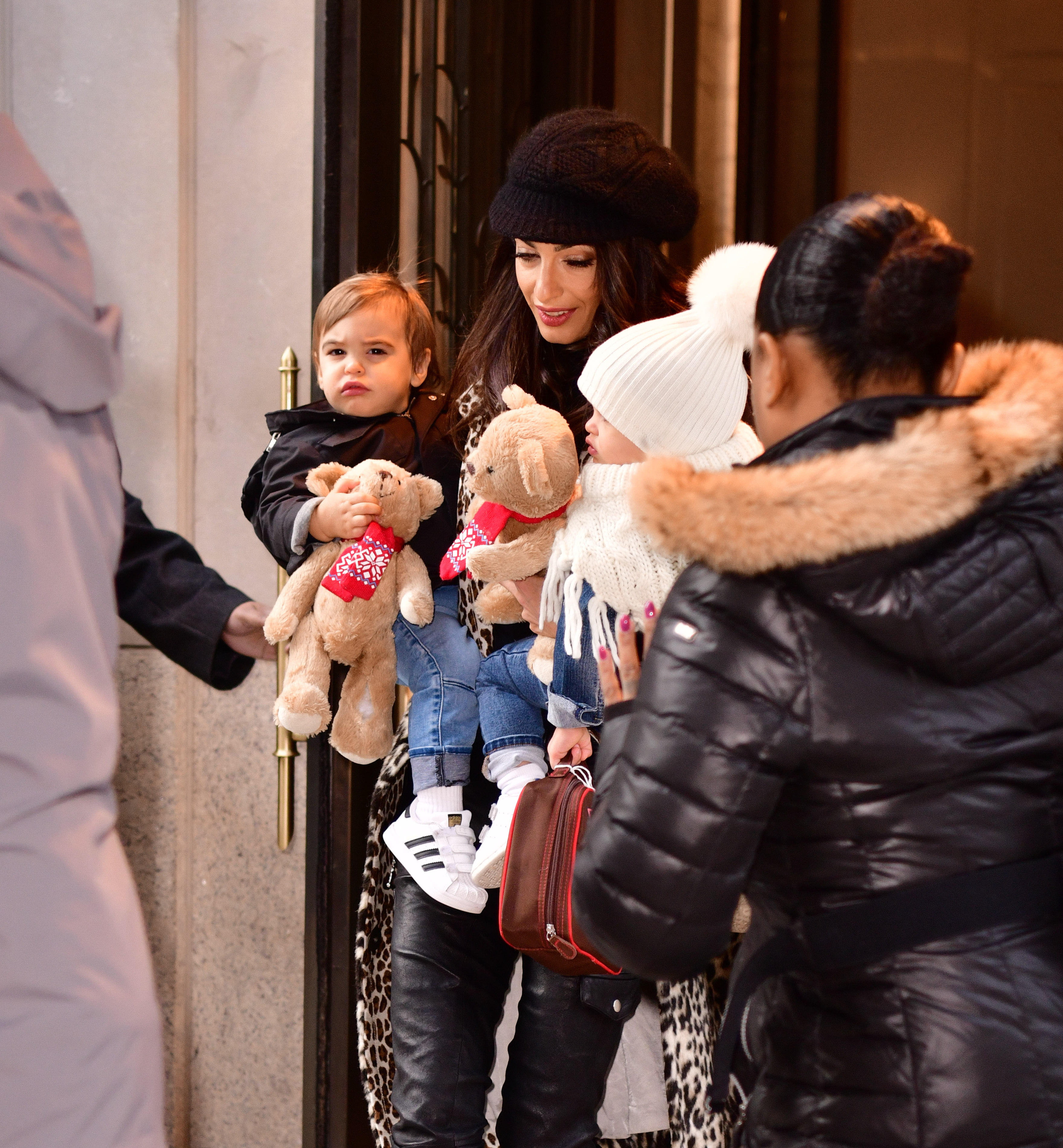 Amal Clooney seen with her and George Clooney's twins in New York City on December 6, 2018 | Source: Getty Images