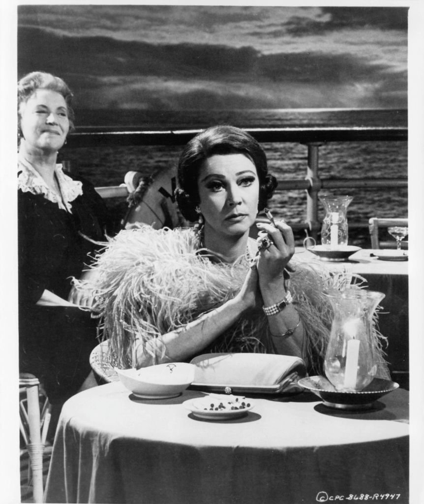 Pictured: Vivien Leigh sitting at table on the deck in a scene from the film "Ship Of Fools" in 1965 | Photo: Getty Images