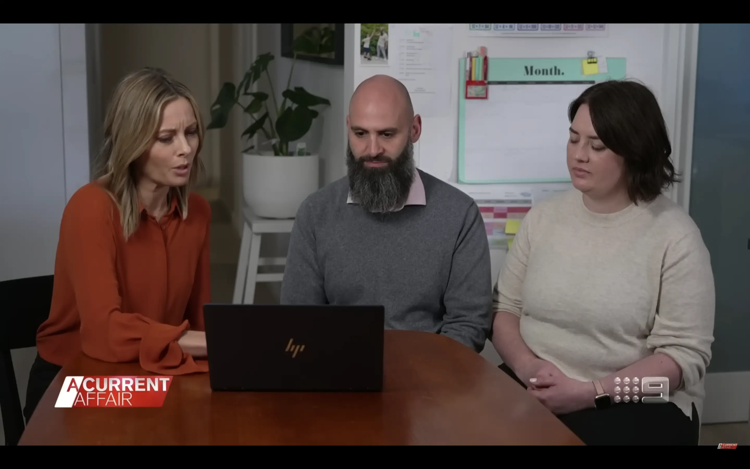 Leah and Vince with an interviewer watching the controversial video.│Source: youtube.com/A Current Affair