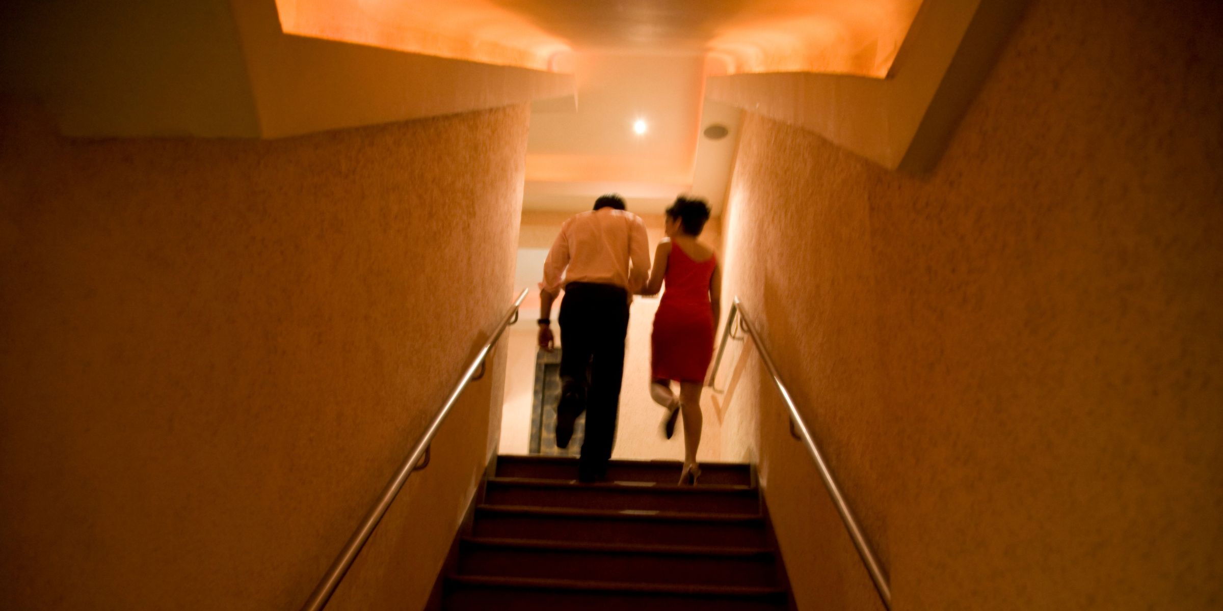 A couple going up the stairs | Source: Getty Images