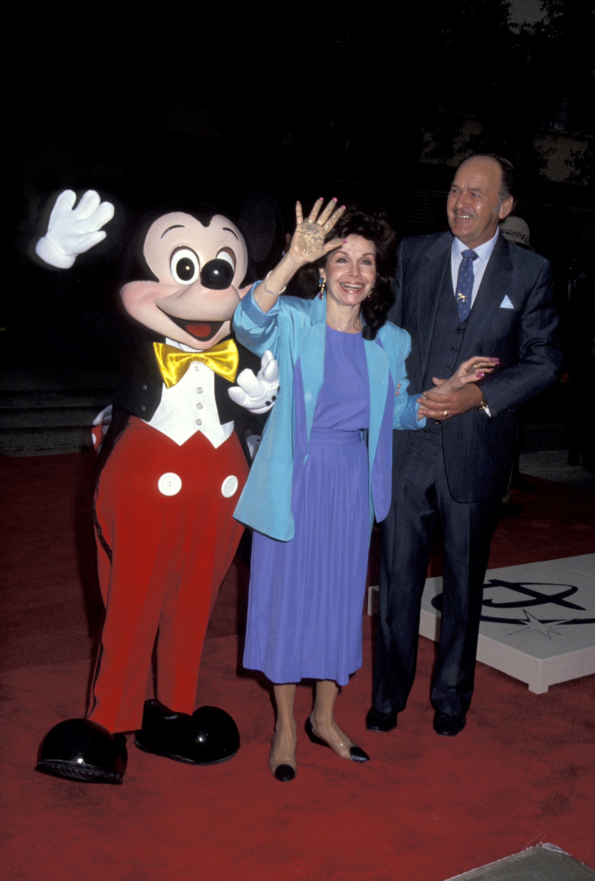 Annette Funicello and Glen Holt with Mickey Mouse during Disney Legends Awards at Walt Disney Studios in Burbank, California, United States. | Source: Getty Images