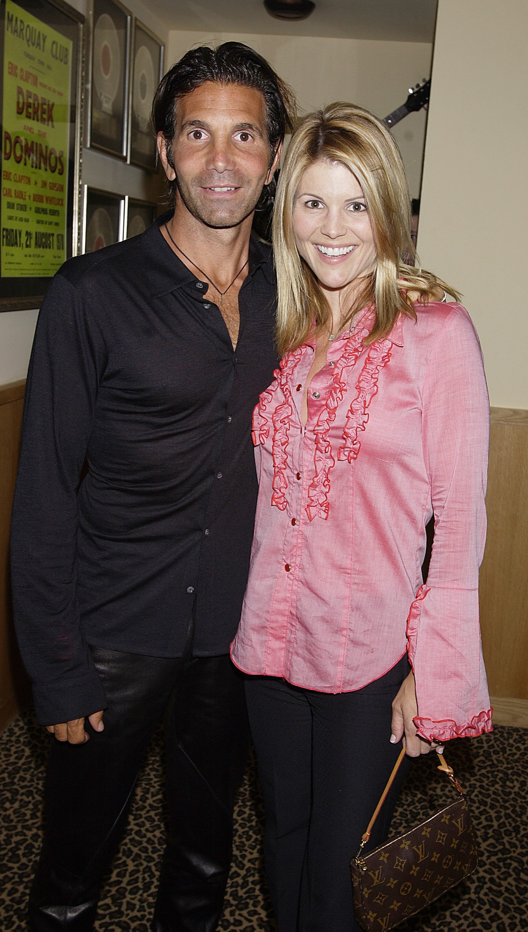  Lori Laughlin and Mossimo Giannulli arrive April 26, 2002 at the Hard Rock Hotel in Las Vegas. | Source: Getty Images