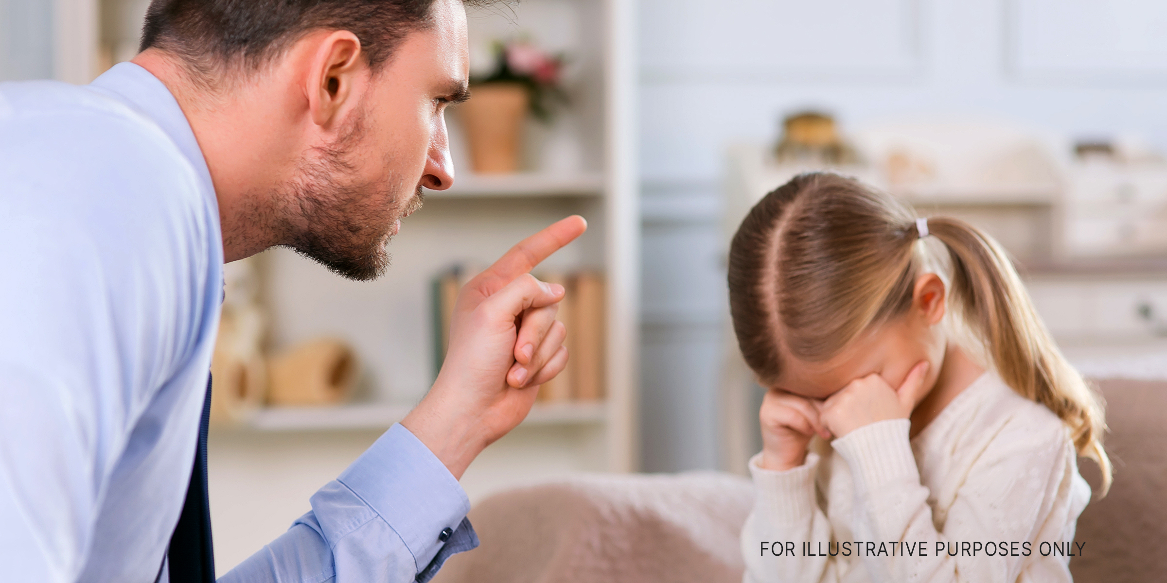A father disciplining his daughter | Source: Shutterstock