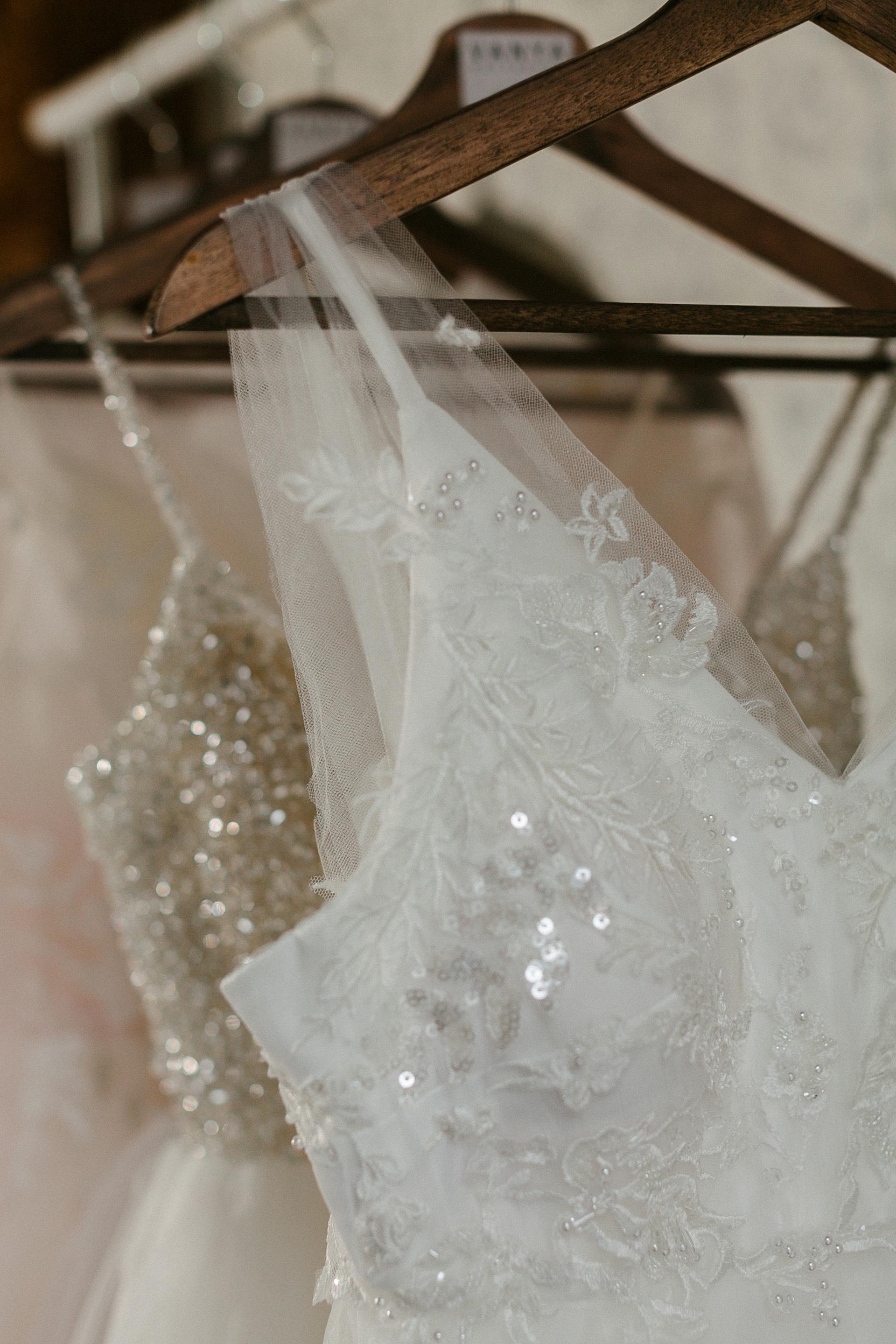 Wedding dresses on hangers | Source: Pexels