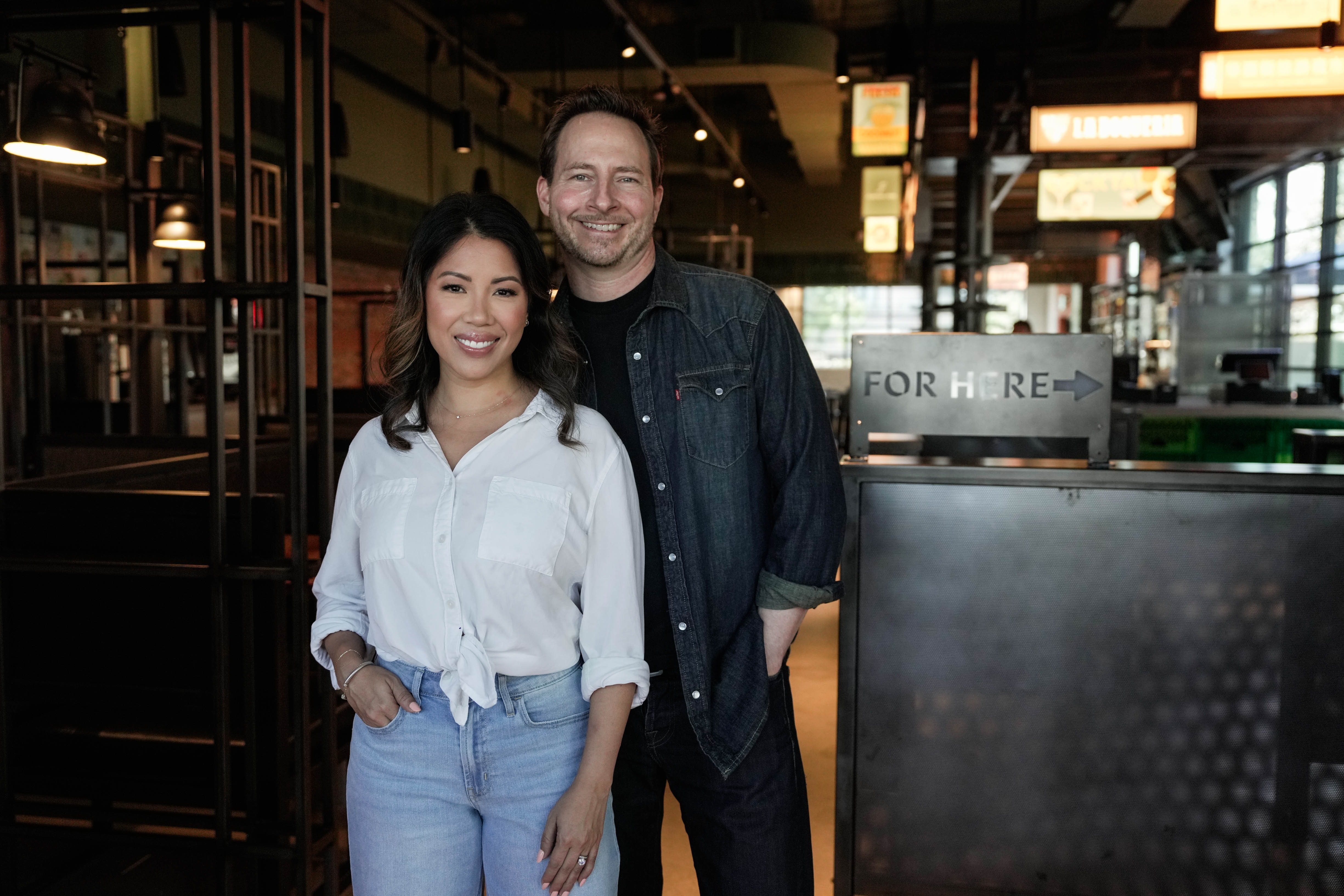 Thy and Matthew Mitchell pose inside Traveler's Cart ahead of the restaurant's opening in Houston on October 14, 2024 | Source: Getty Images