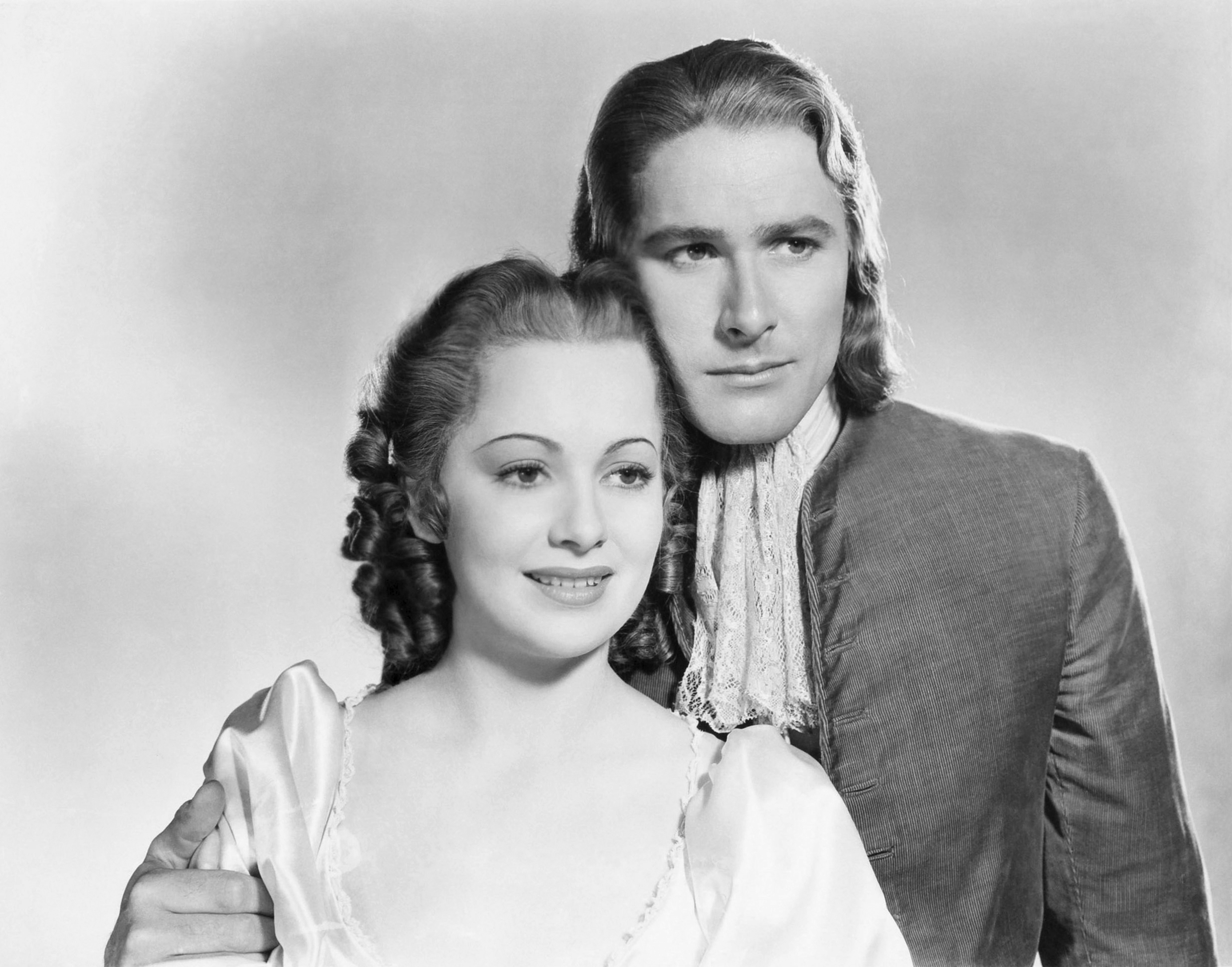 Actress Olivia de Havilland and Errol Flynn in a scene from the movie "Captain Blood" in 1935 | Source: Getty Images