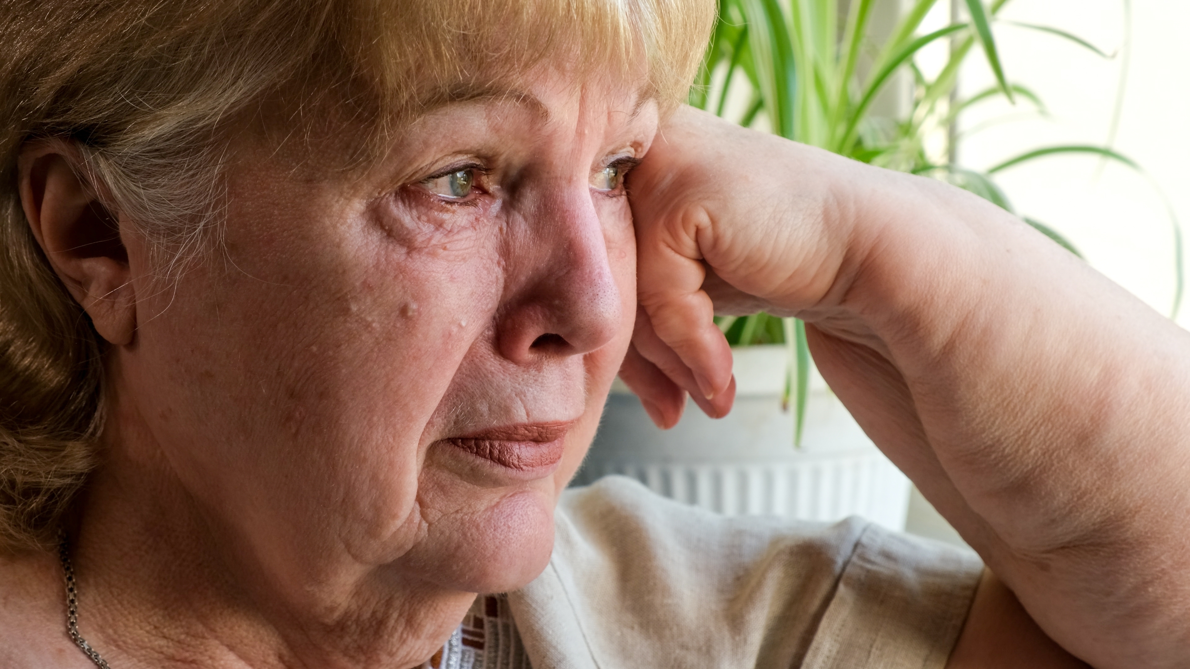 An elderly woman looking worried | Source: Shutterstock