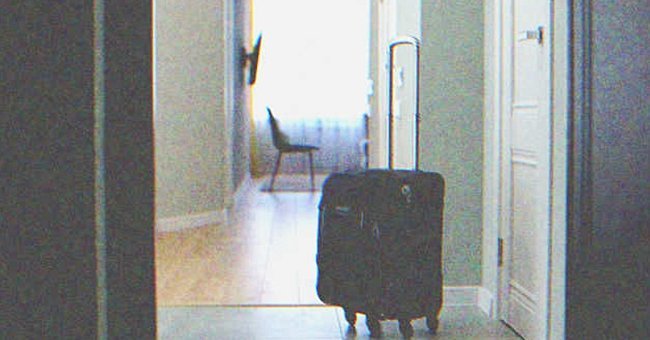 Suitcase near the door | Source: Shutterstock