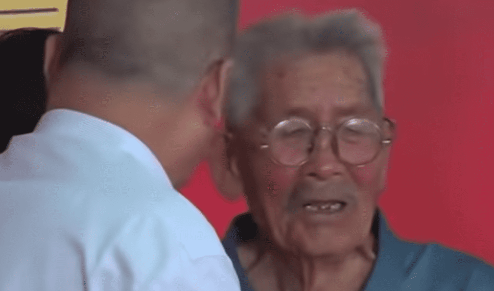 A screenshot from the emotional moment father and son reunited | Photo:  youtube.com/China Today News 