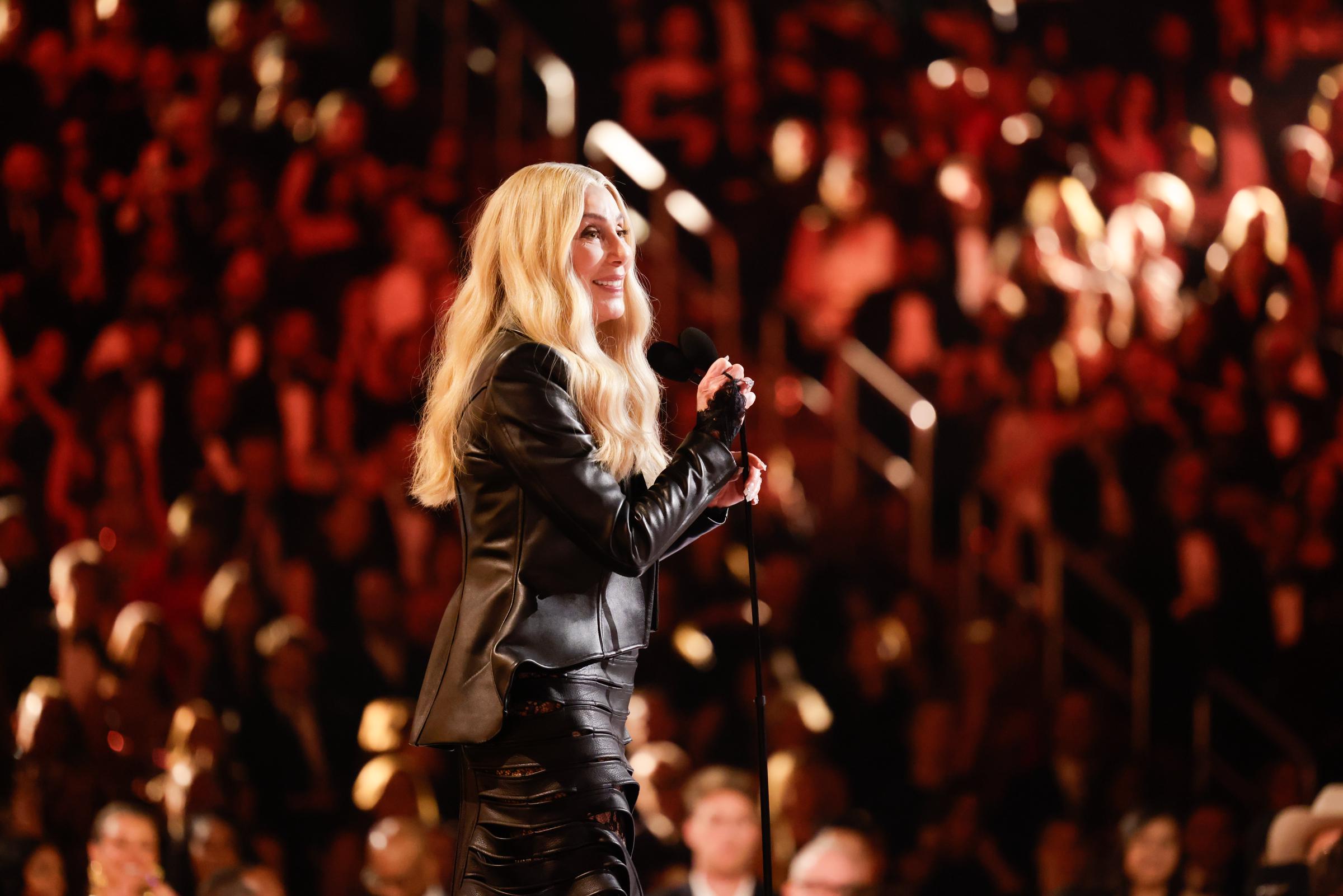 Cher addresses the audience from the stage during the 68th Annual Grammy Awards at Crypto.com Arena on February 1, 2026 | Source: Getty Images