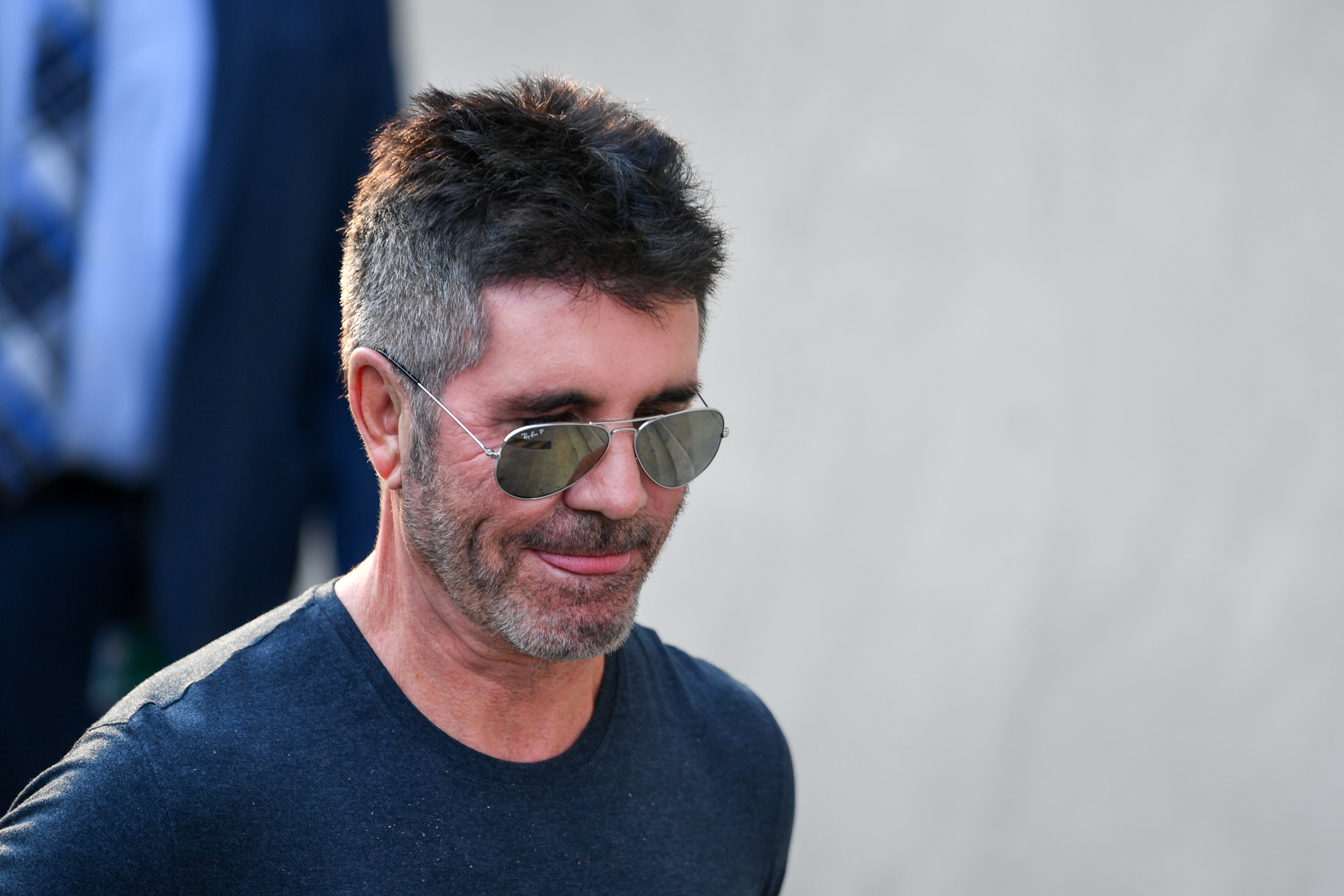 Simon Cowell leaves Global Radio Studios in London, England on December 7, 2022.