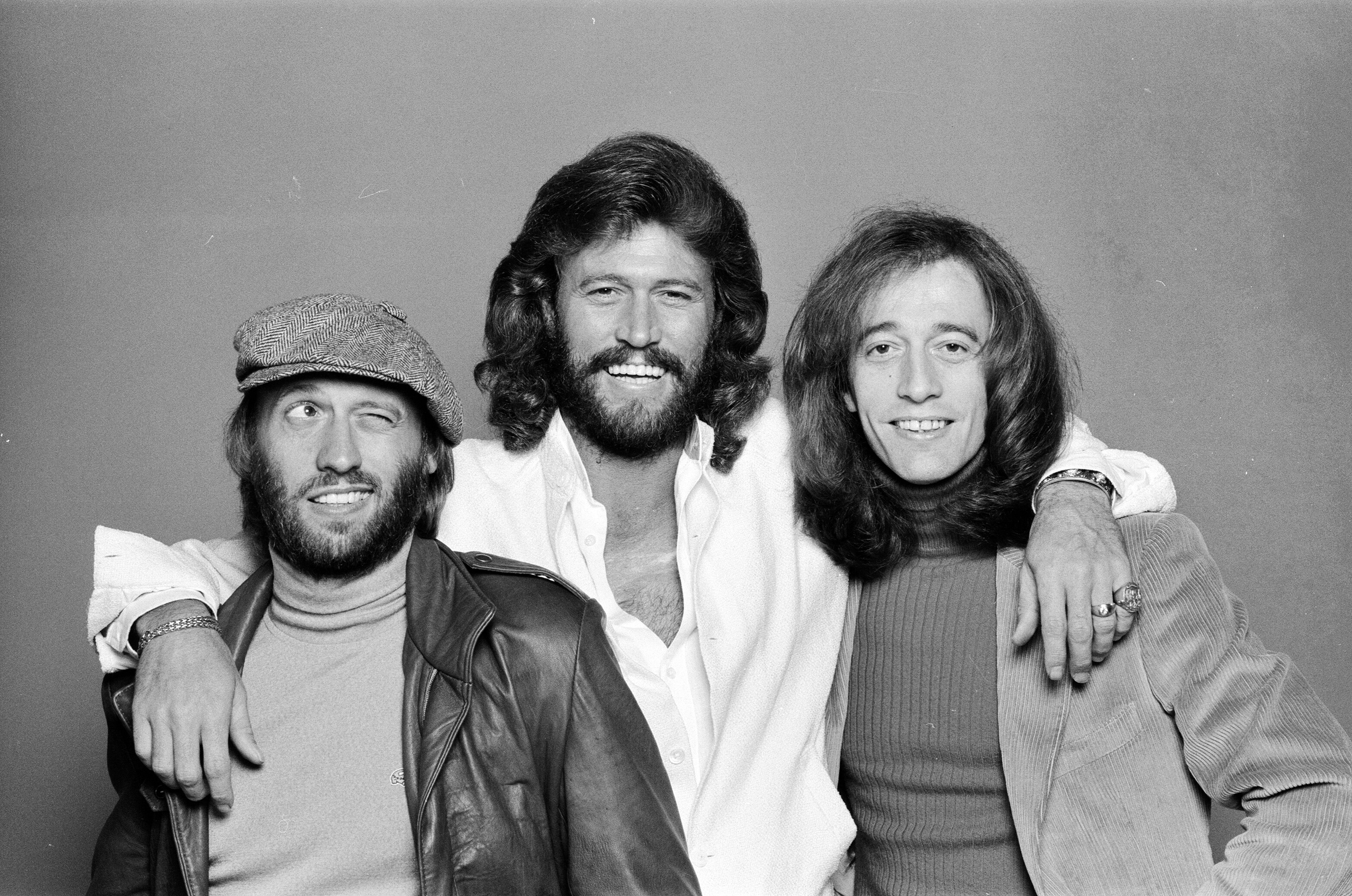 The Bee Gees: Maurice, Barry, and Robin Gibb posing in a black and white picture in 1981 | Source: Getty Images