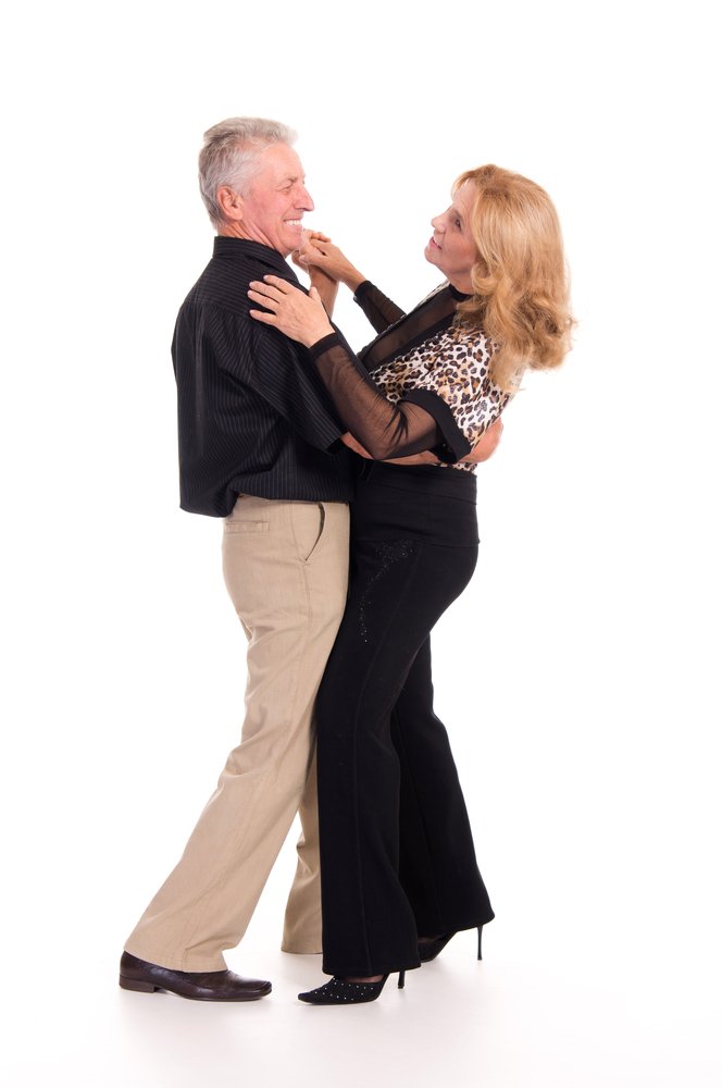 A portrait of a cheerful senior couple dancing. | Photo: Shutterstock