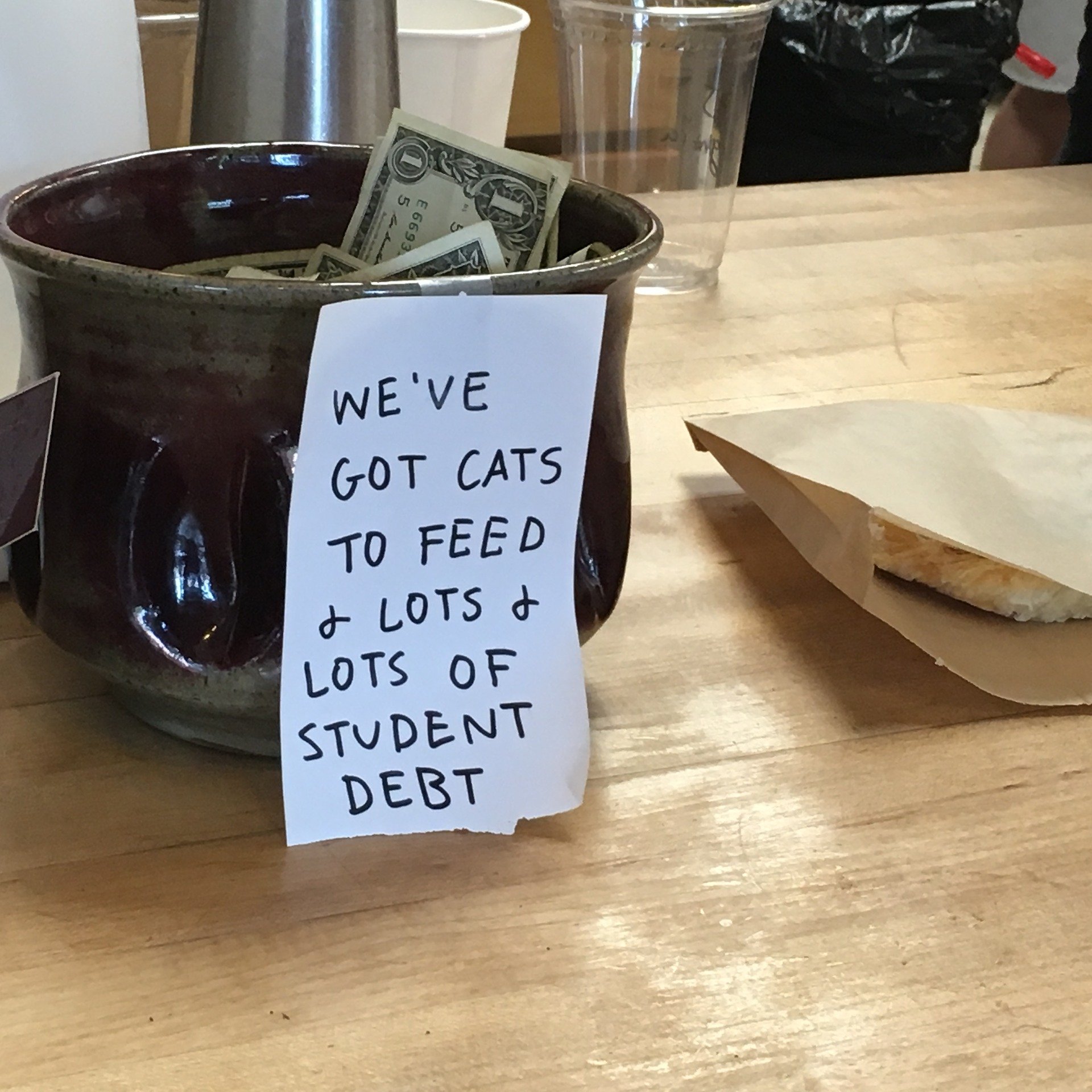 Tip jar at a local diner stuffed with $1 notes. | Source: Pixabay/Tad Hanna