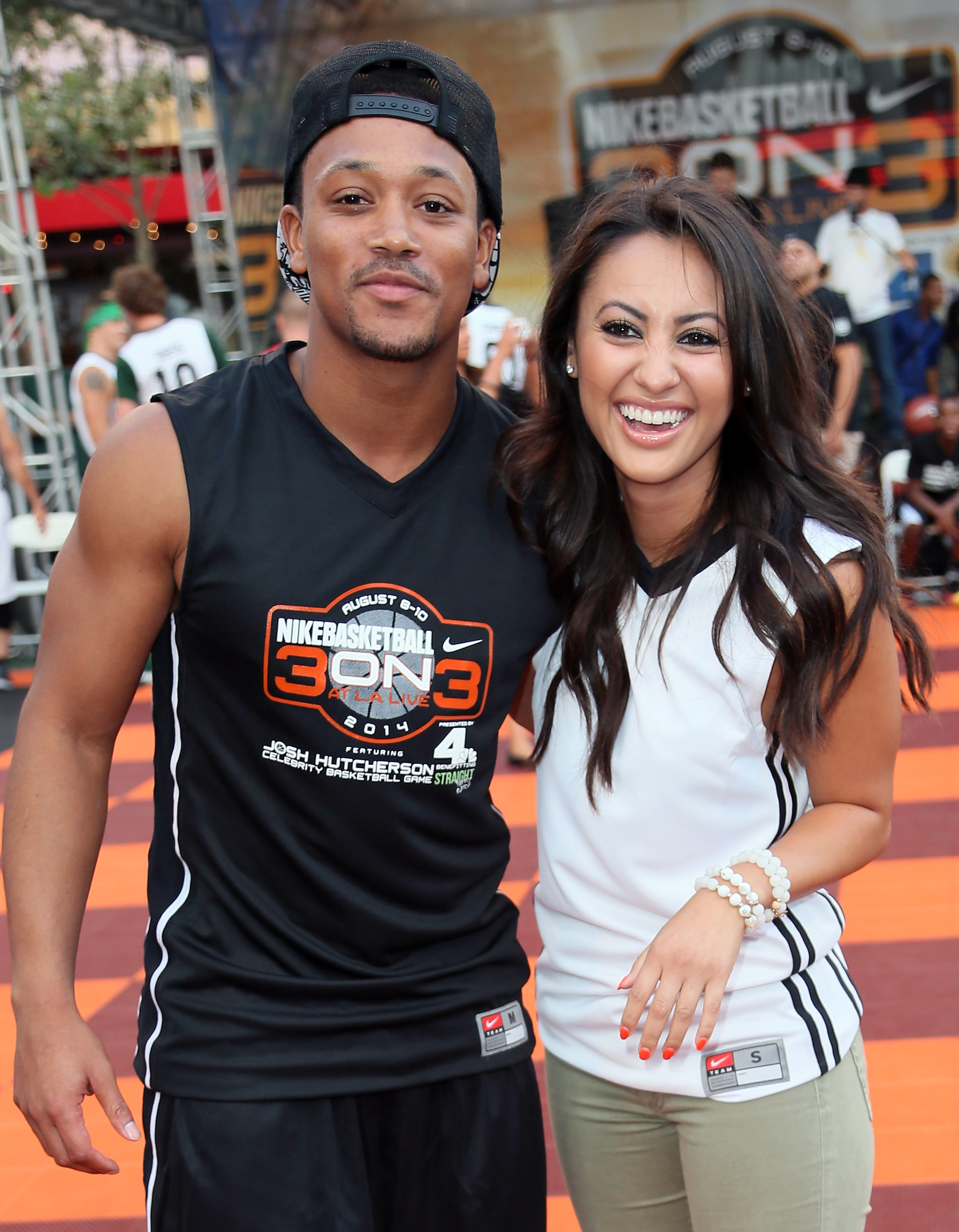 Rapper Romeo Miller and Francia Raisa attend the 3rd Annual Josh Hutcherson Celebrity Basketball Game at Nokia Plaza L.A. LIVE on August 8, 2014, in Los Angeles, California | Source: Getty Images