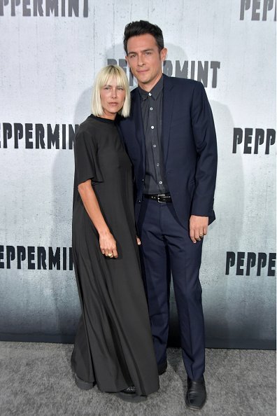  Nicole Vicius (L) and John Boyd attend the premiere of STX Entertainment's "Peppermint" at Regal Cinemas L.A. LIVE Stadium 14 on August 28, 2018, in Los Angeles, California. | Source: Getty Images.
