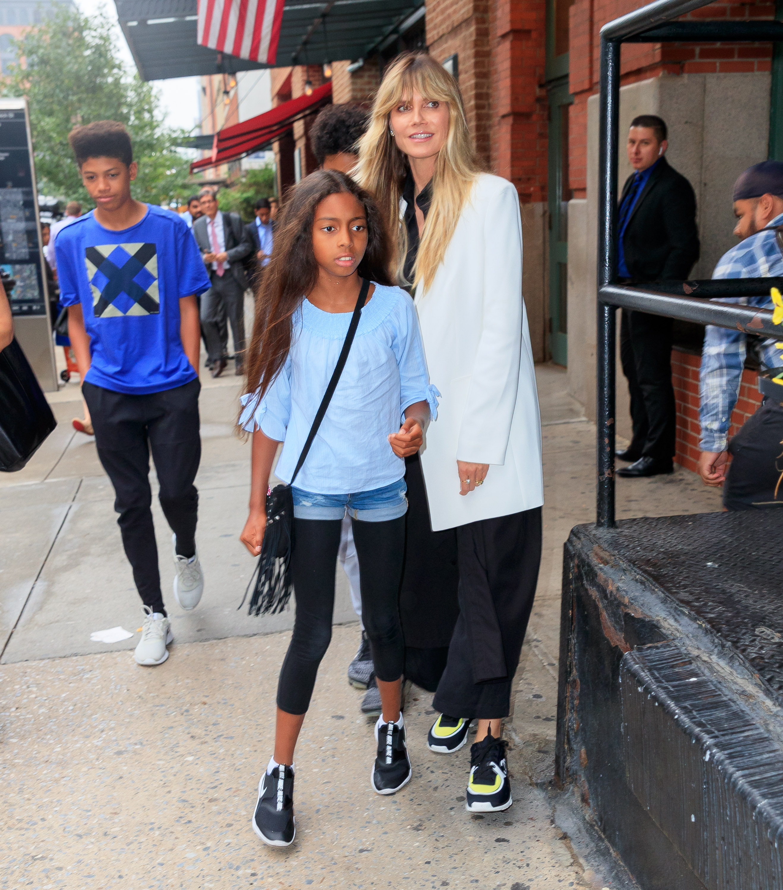 Heidi Klum walks to dinner with Lou Samuel and her sons on June 19, 2019, in New York City | Source: Getty Images