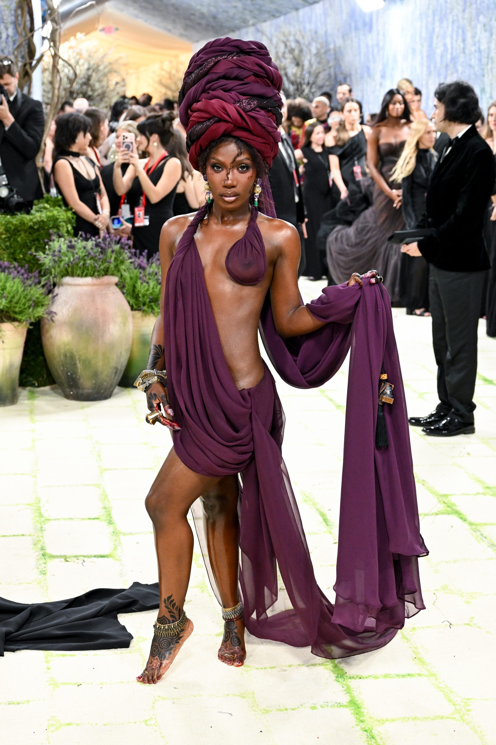 Doechii poses in a bold, expressive look on the Met carpet | Source: Getty Images