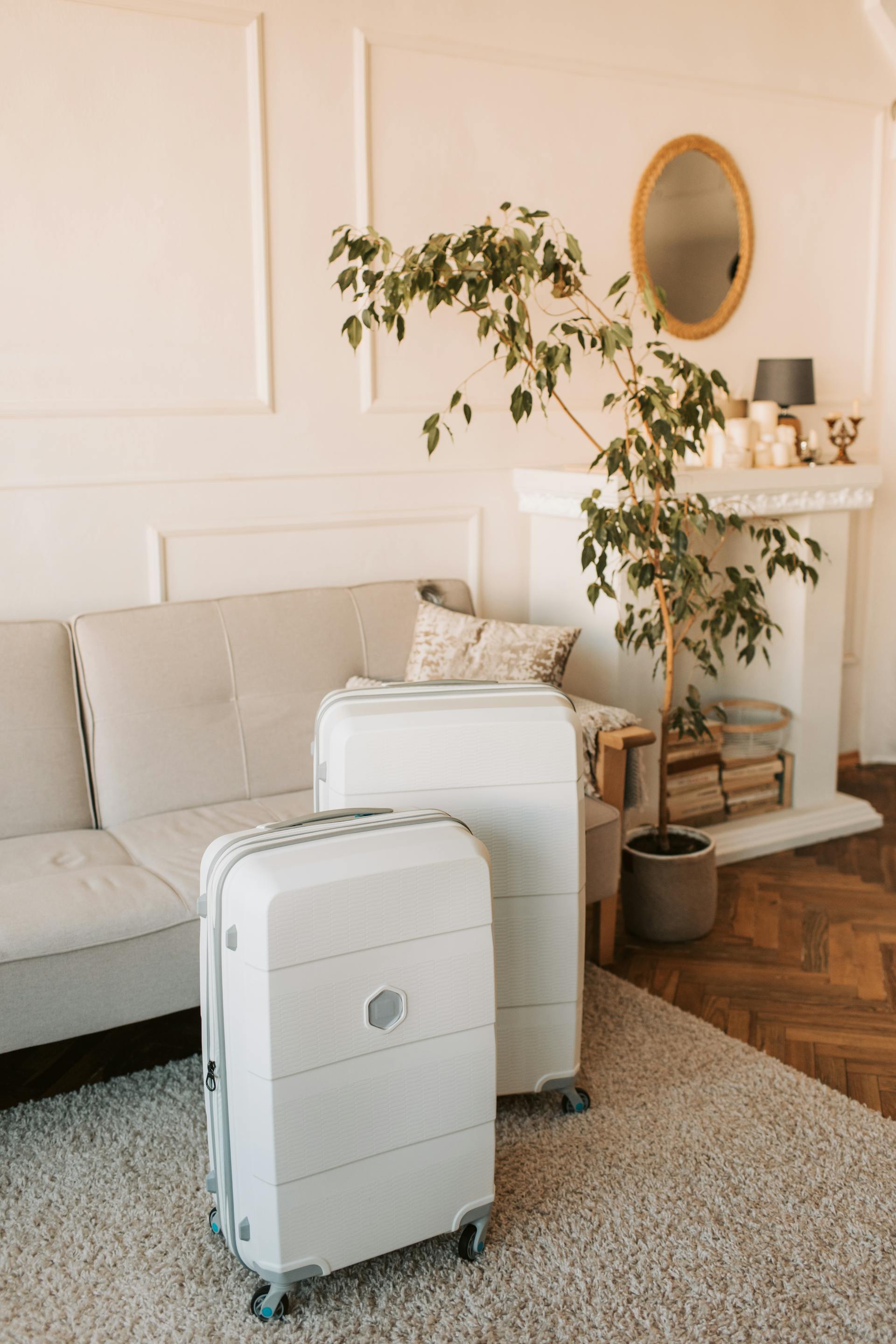 White suitcases in a living room | Source: Pexels