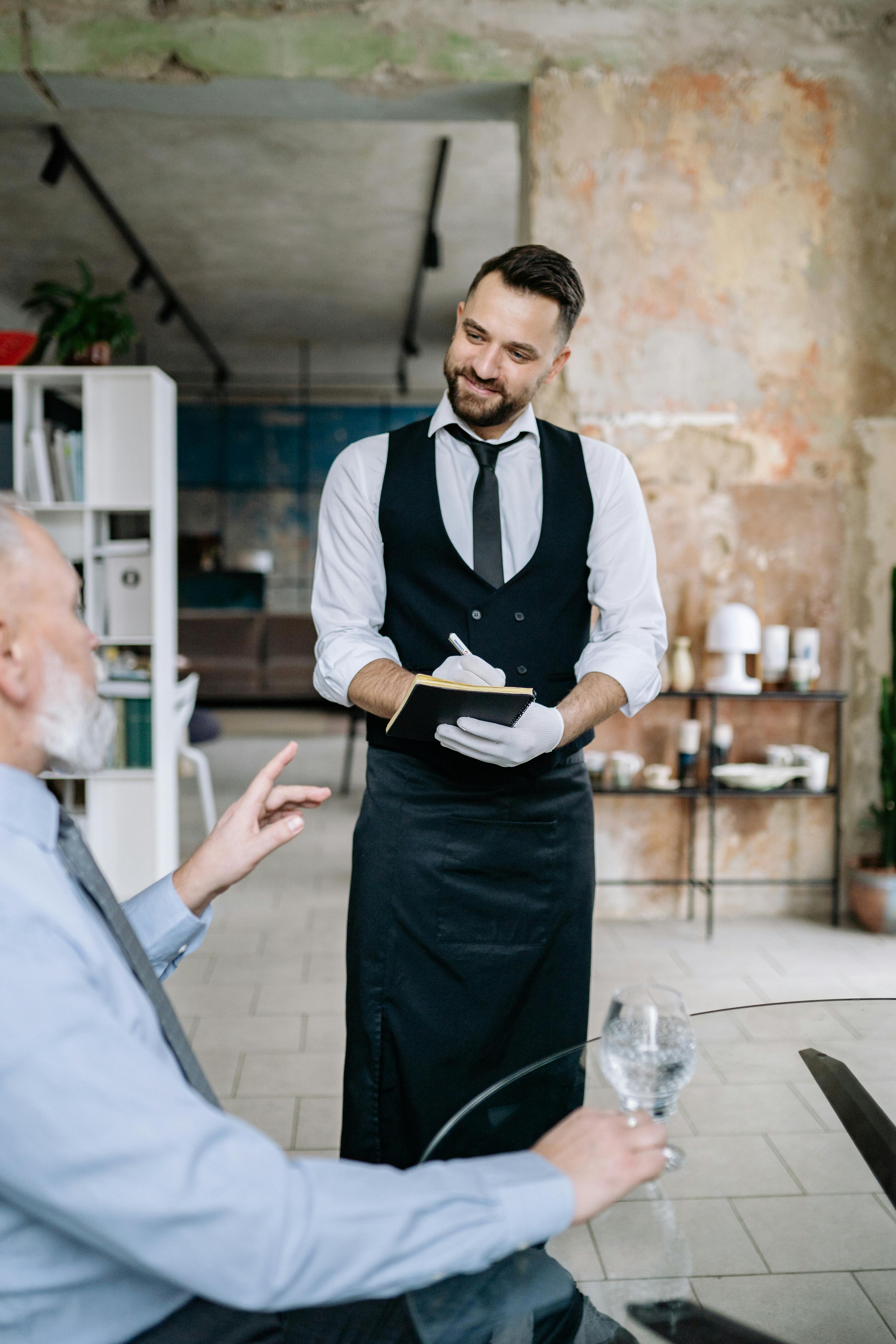 Waiter taking an order | Source: Pexels