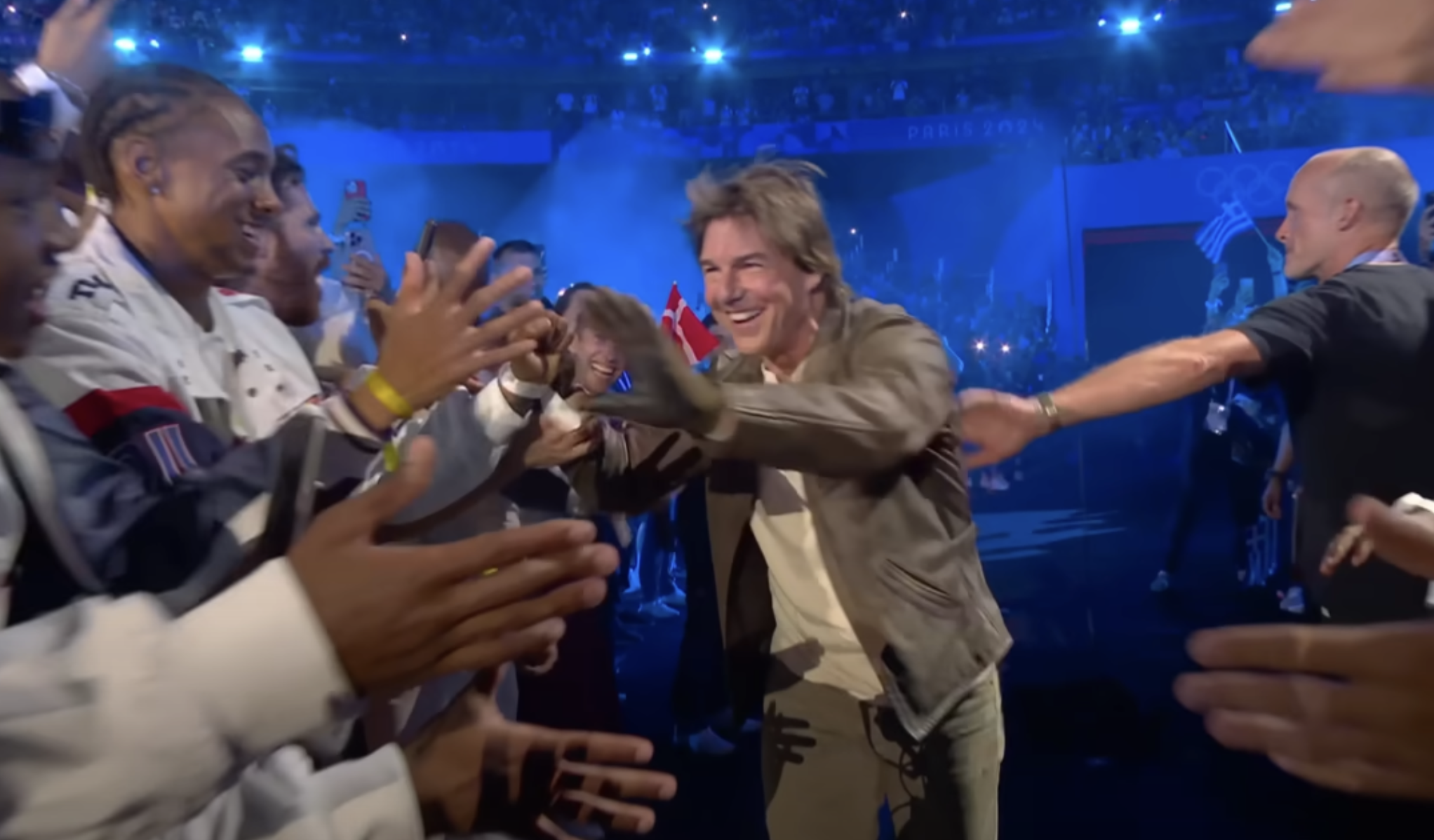 Tom Cruise interacting with athletes during the closing ceremony of the Olympic Games Paris 2024 on August 11 in France. | Source: YouTube/Olympics