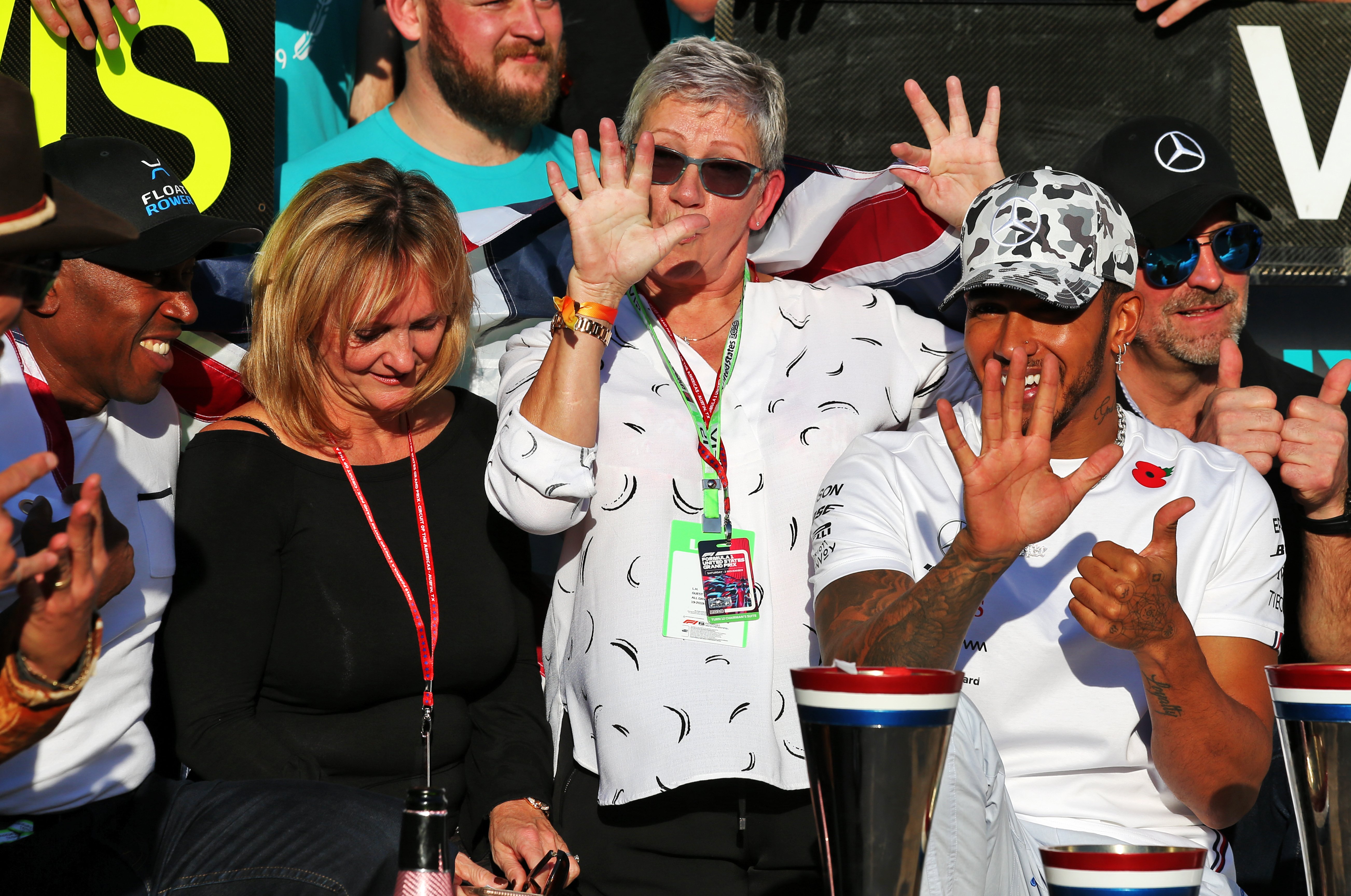 Mercedes driver Lewis Hamilton with his dad Anthony (left), stepmom Linda, and his mum, Carmen Larbalestier, in Austin, Texas. | Source: Getty Images