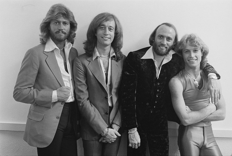 The Bee Gees (Barry, Robin, and Maurice) with their brother Andy Gibb at the Diplomat Hotel in Hollywood, Florida, March 1979 | Photo: Getty Images 