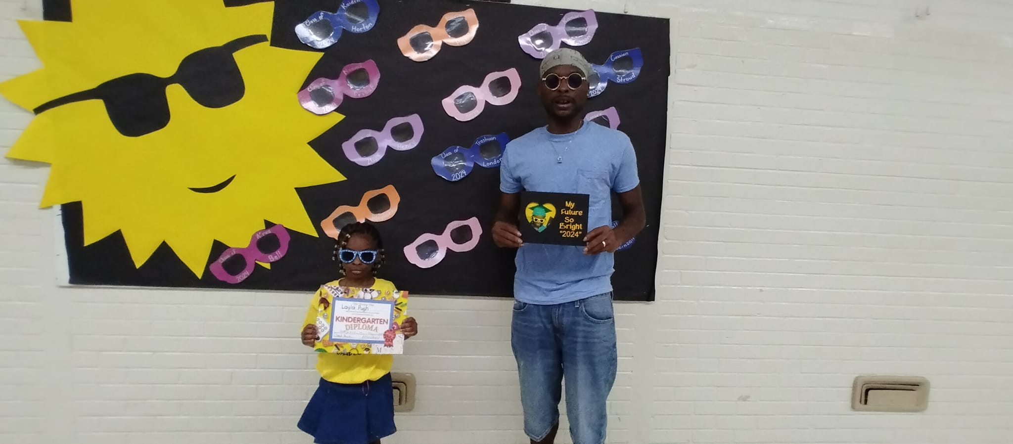 Shamar Elkins with one of his children, posted on May 15, 2024. | Source: Facebook/Shaneiqua Elkins