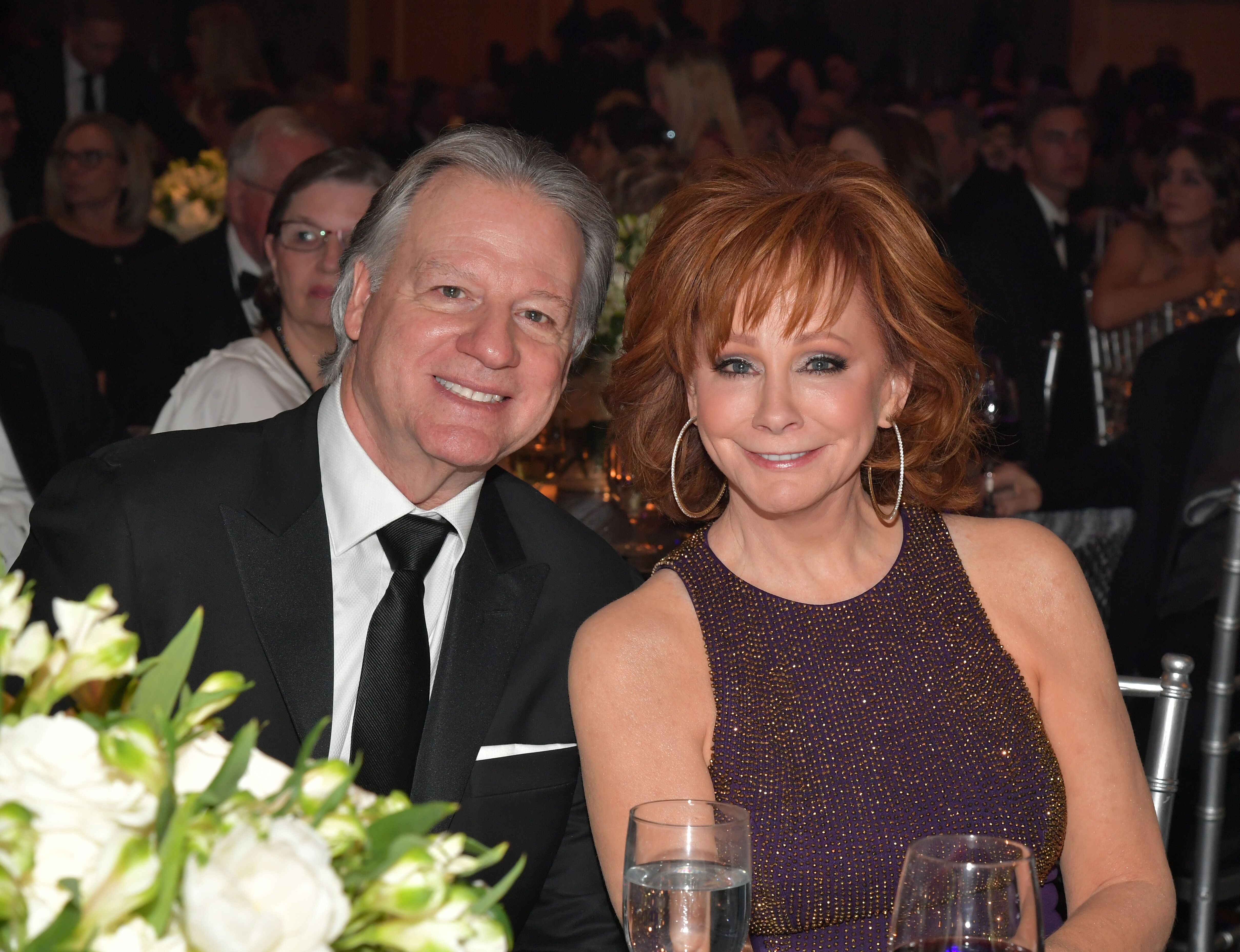 Skeeter Lasuzzo and host Reba McEntire attend Celebrity Fight Night XXV. | Source: Getty Images