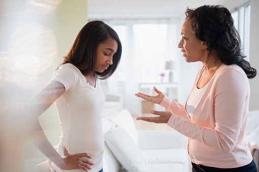 Mother pictured scolding frustrated daughter | Photo: Getty Images