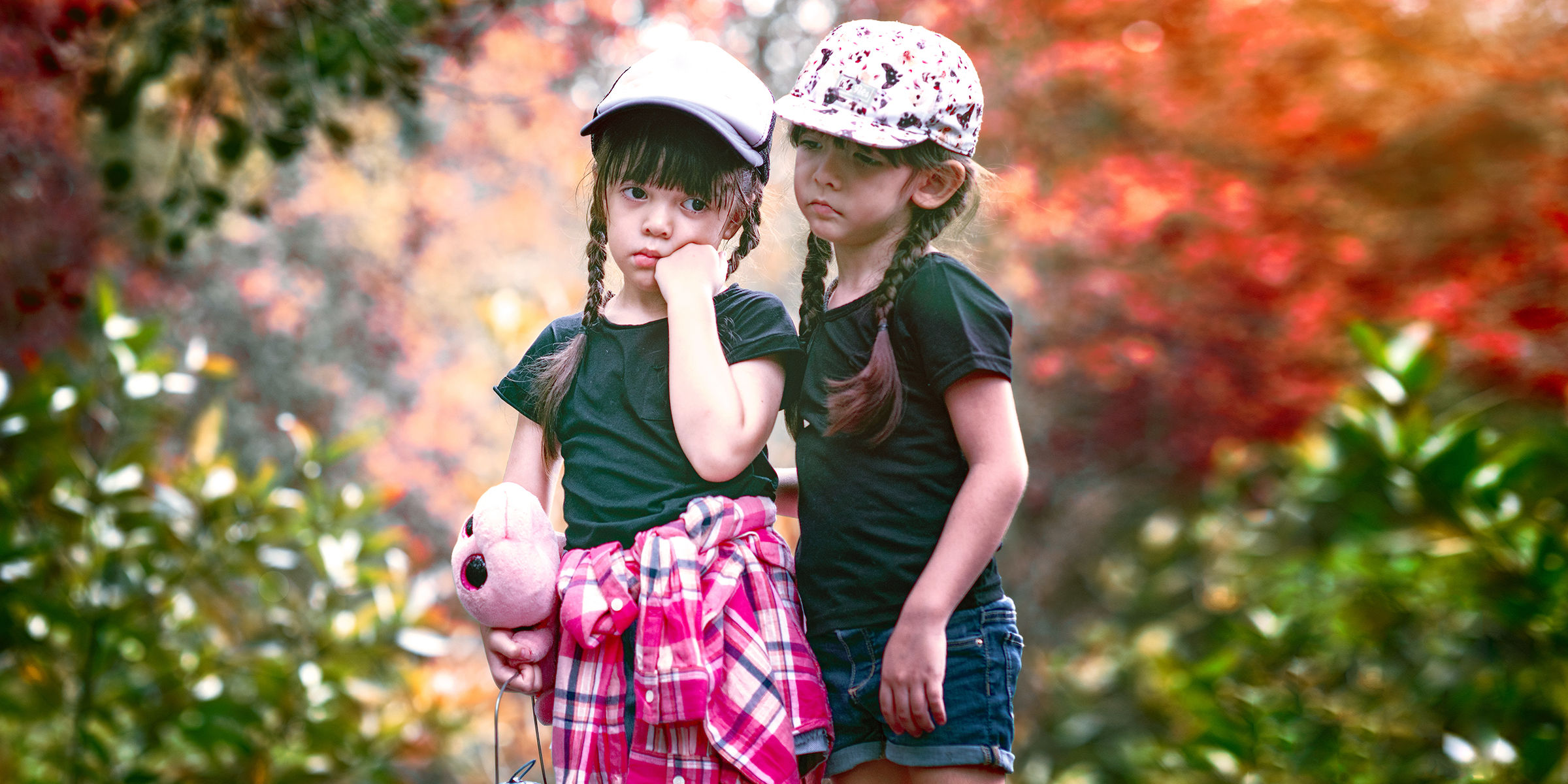Two girls in a park | Source: Shutterstock